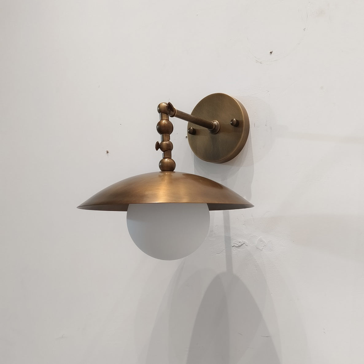 Detail of the dome shade and its connection to the arm.