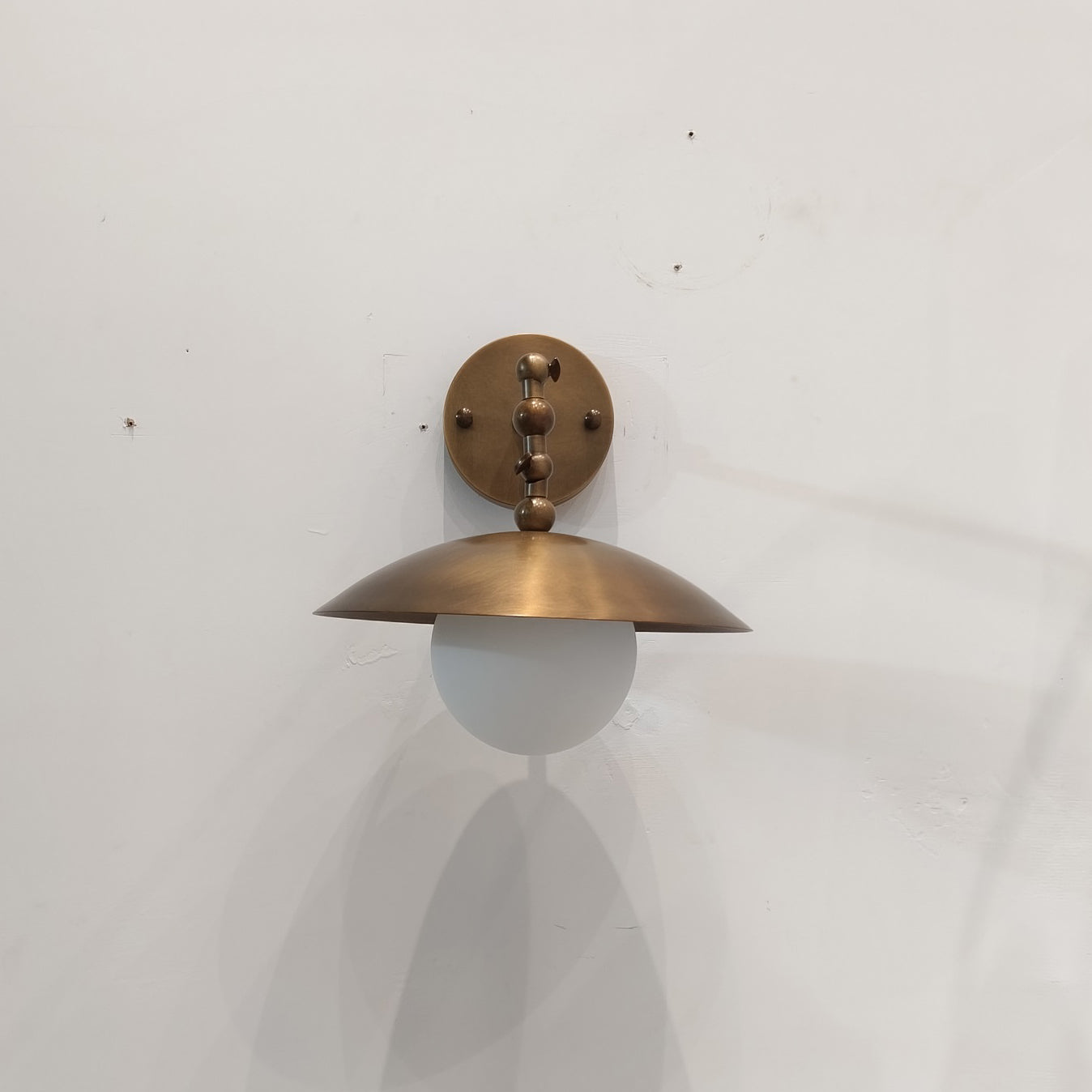 Marie Petite Wall Sconce in a hallway setting.
