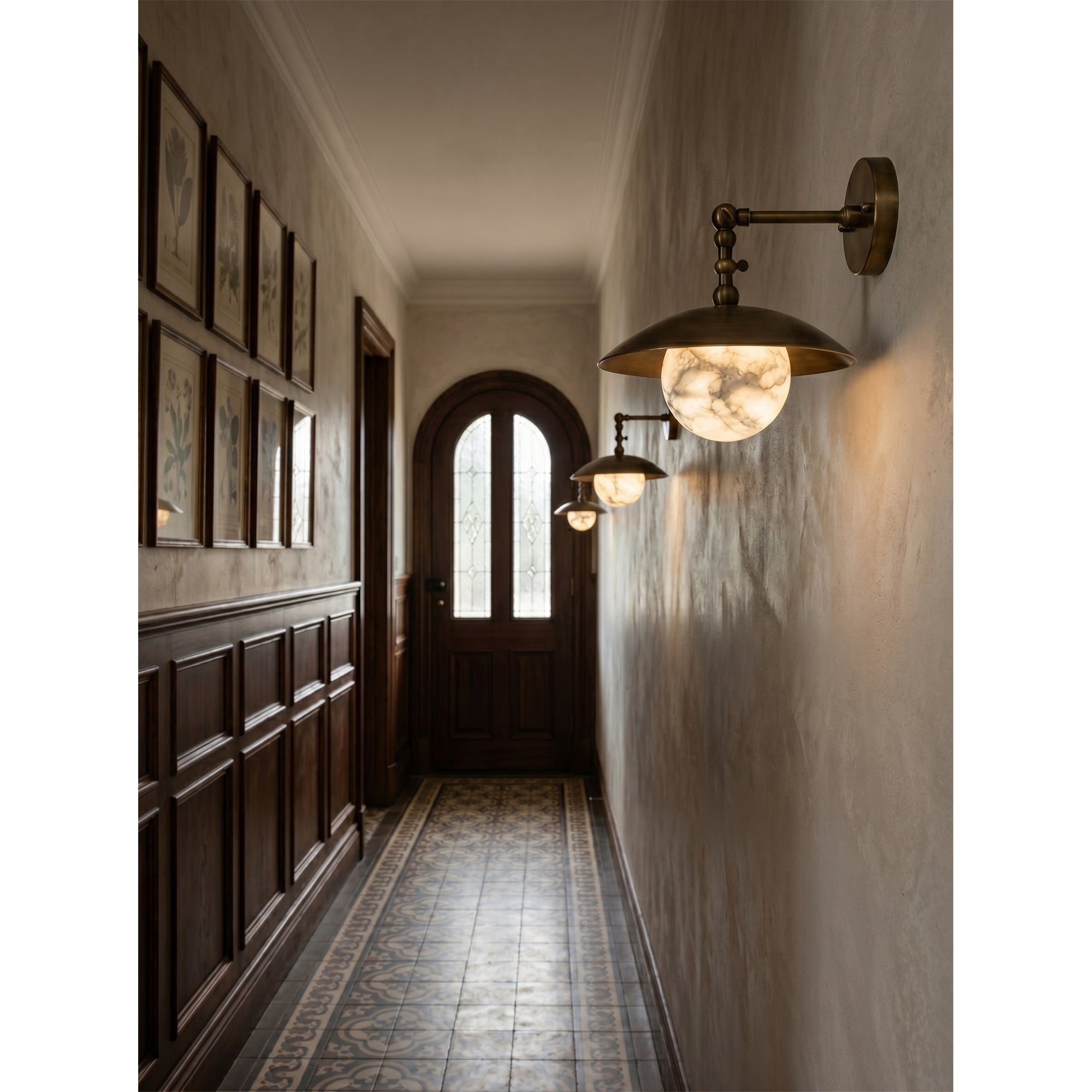 Marie Petite Wall Sconce shown in a living room setting.