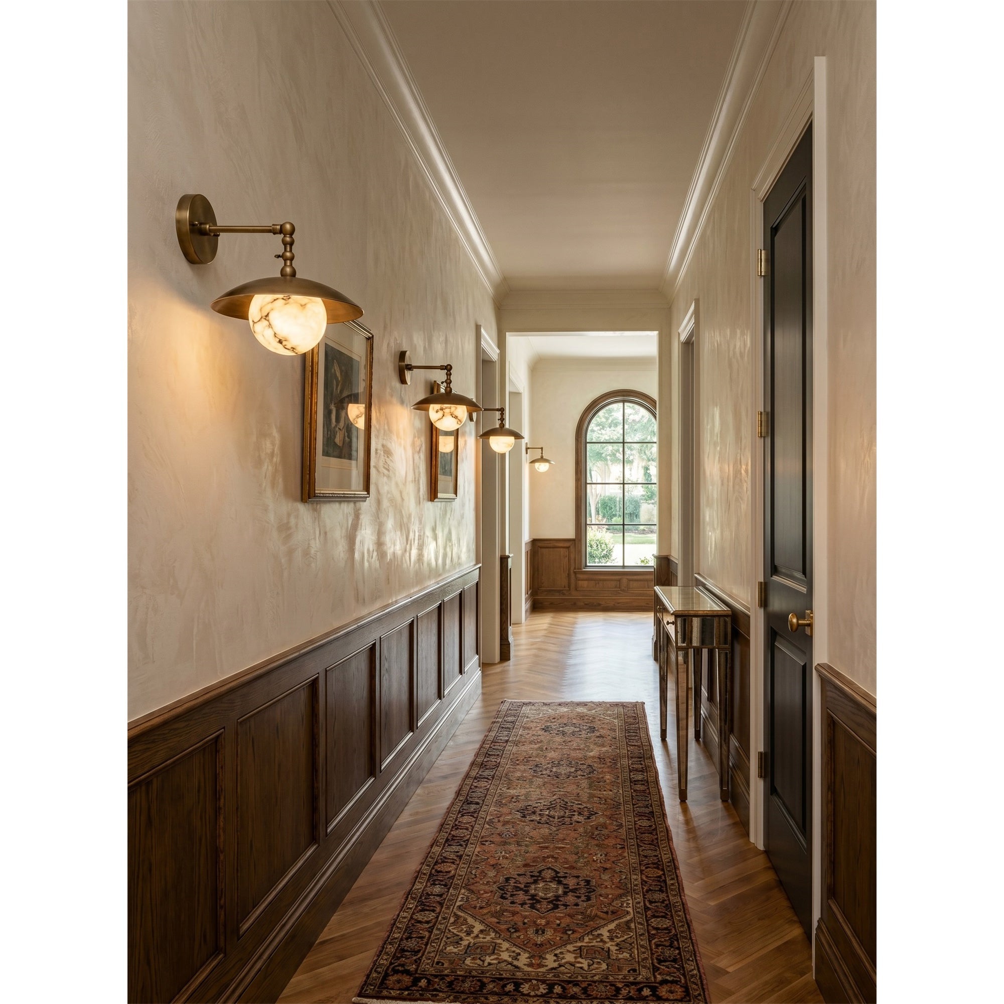 A pair of Marie Petite Wall Sconces flanking a bathroom vanity mirror.