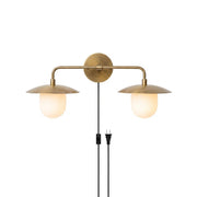 Marie Petite Plug-in Wall Sconce in antique brass finish.
