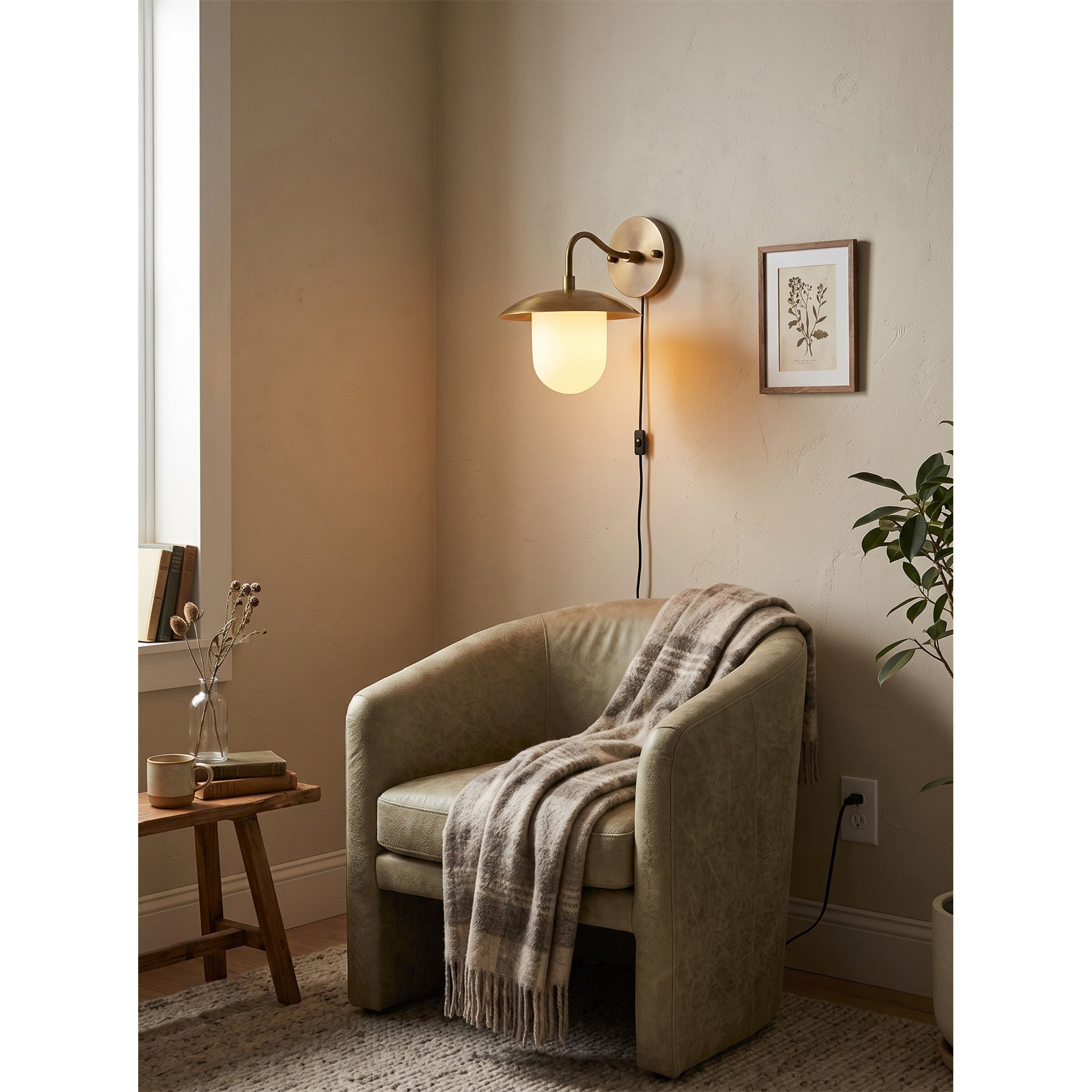 Marie sconce casting a soft, ambient glow in a dimly lit room.