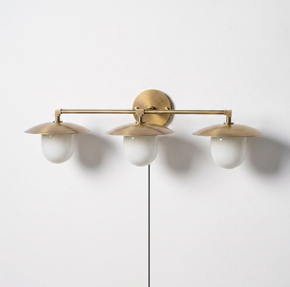 The 2-head Marie sconce in a transitional bedroom setting.