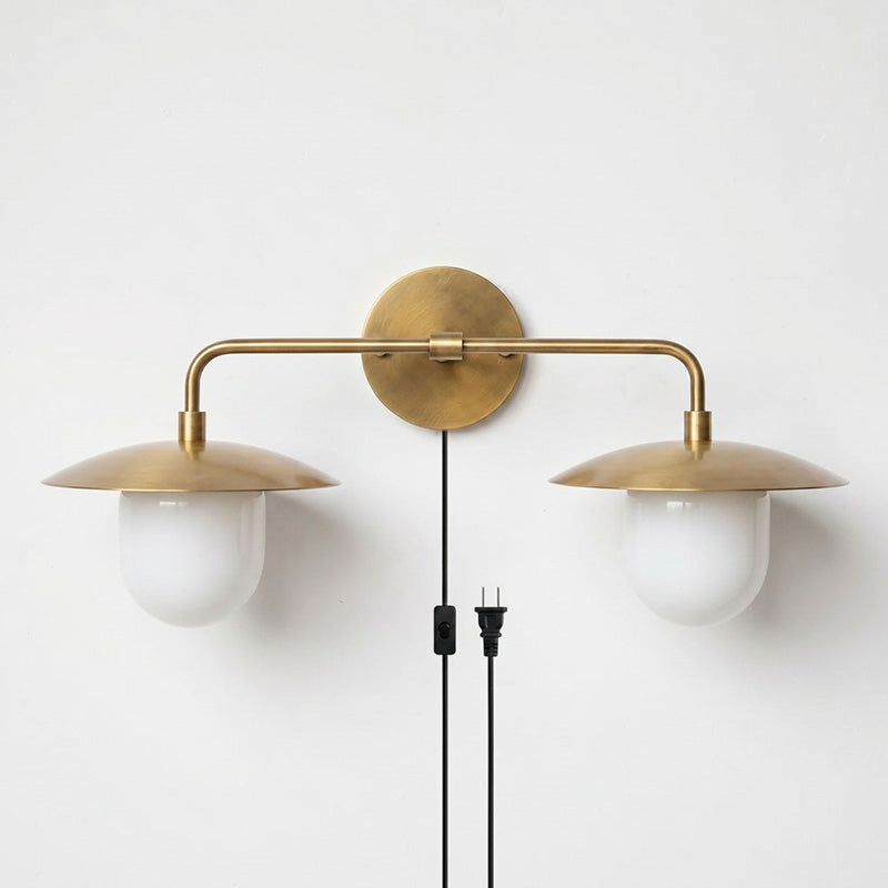 Angled view of the 2-head Marie sconce showing the frosted glass globes.