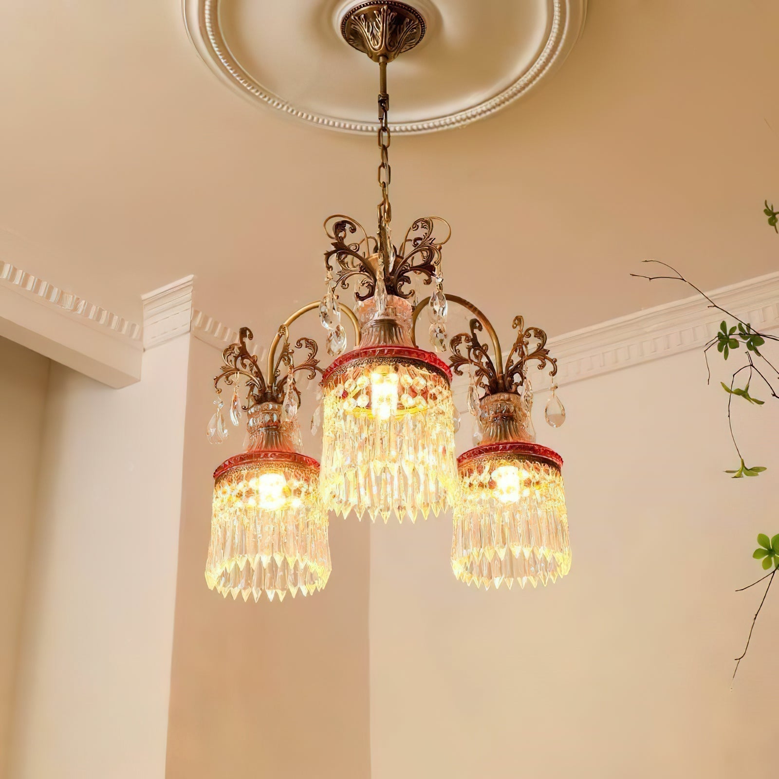 Close-up view of the intricate brass detailing and crystal drops on the Marquise Chandelier.