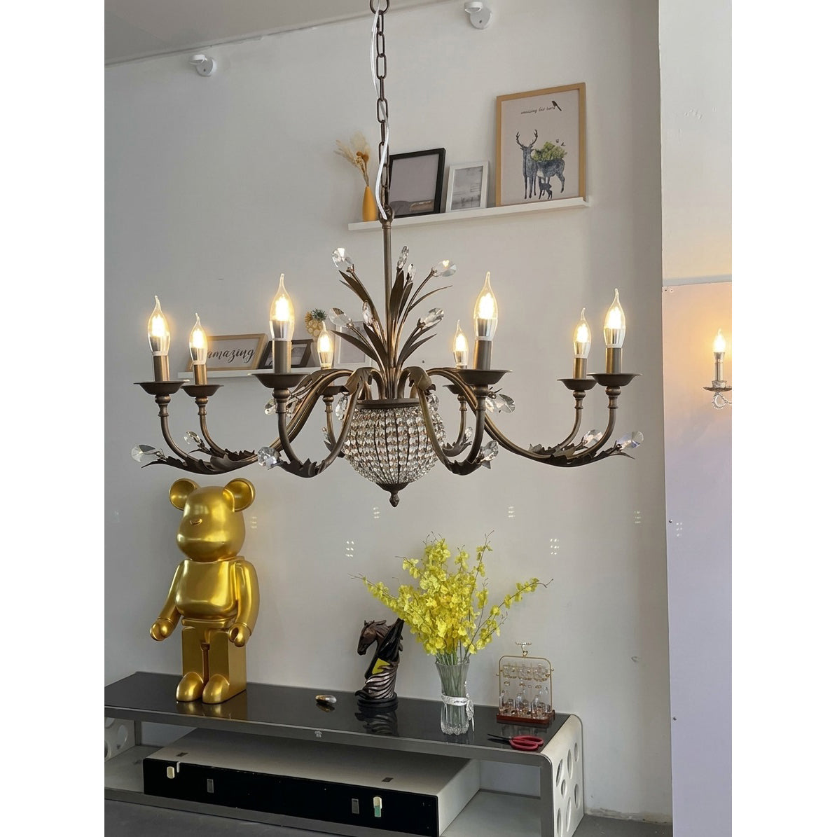 Another angle of the chandelier in a dining room.