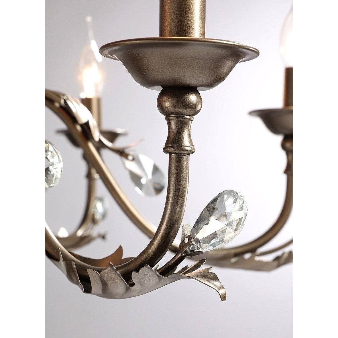 The chandelier from a distance in a large room.