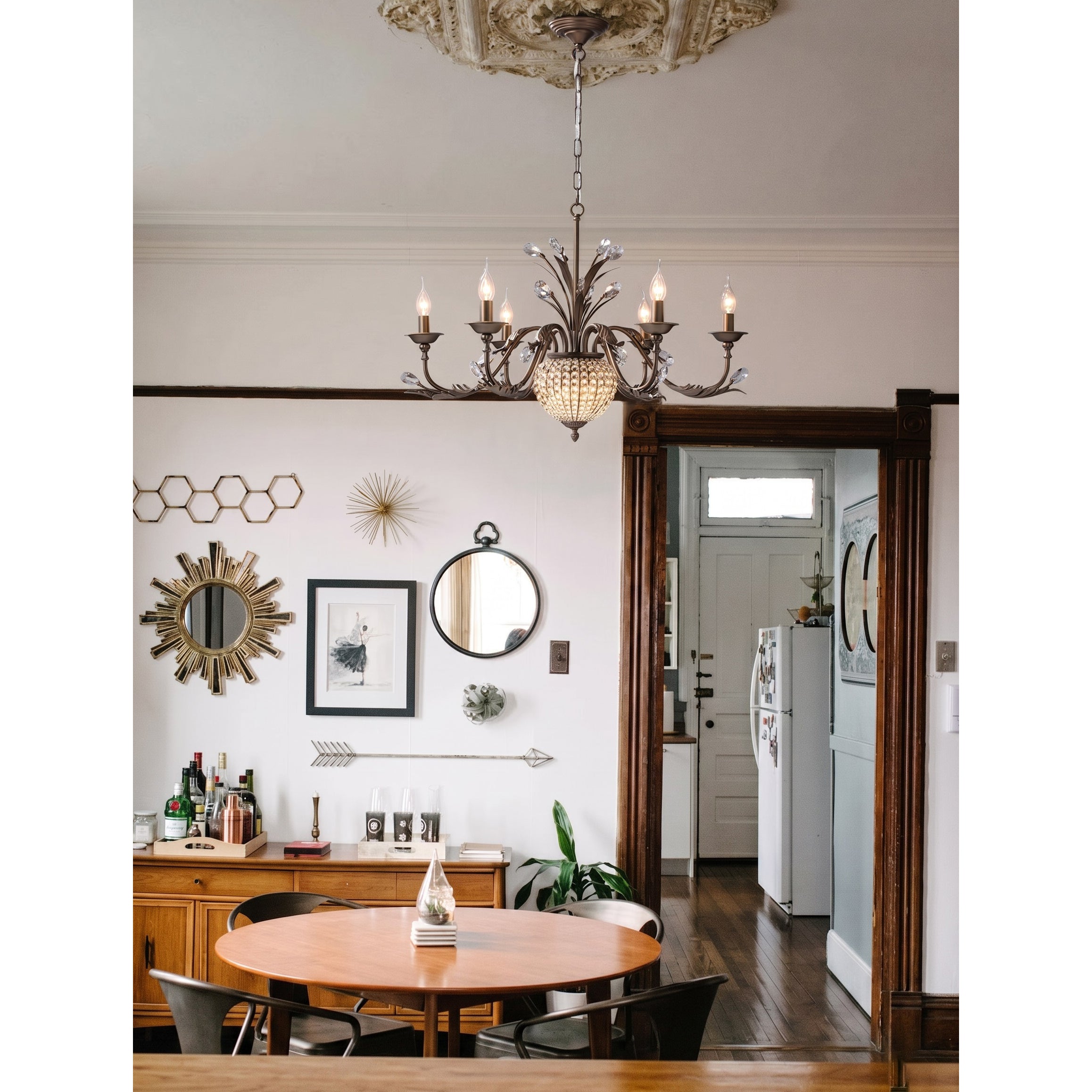 Maxax chandelier hanging in a grand two-story foyer.