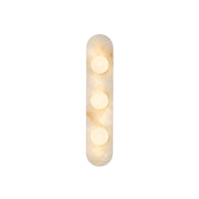Modulo Alabaster Wall Sconce in a modern living room setting.
