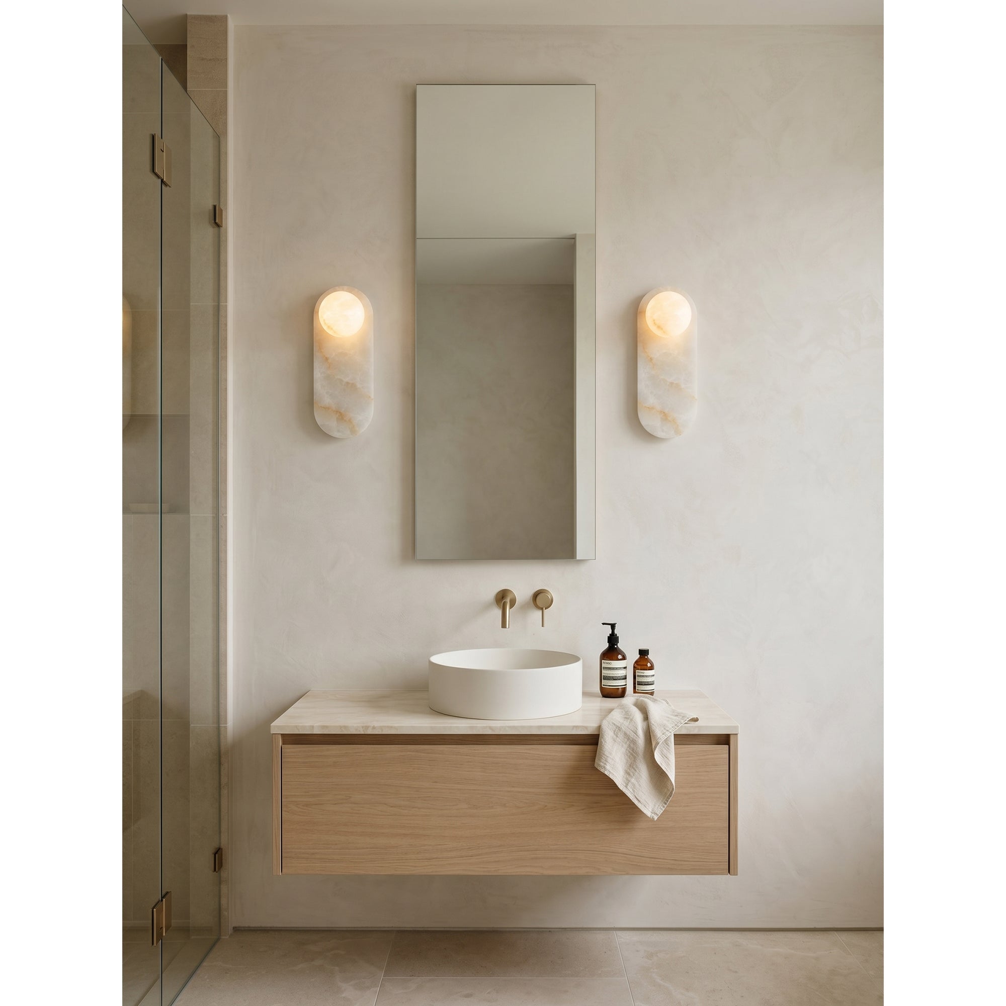 Lifestyle image of the Modulo sconce in an organic modern entryway.