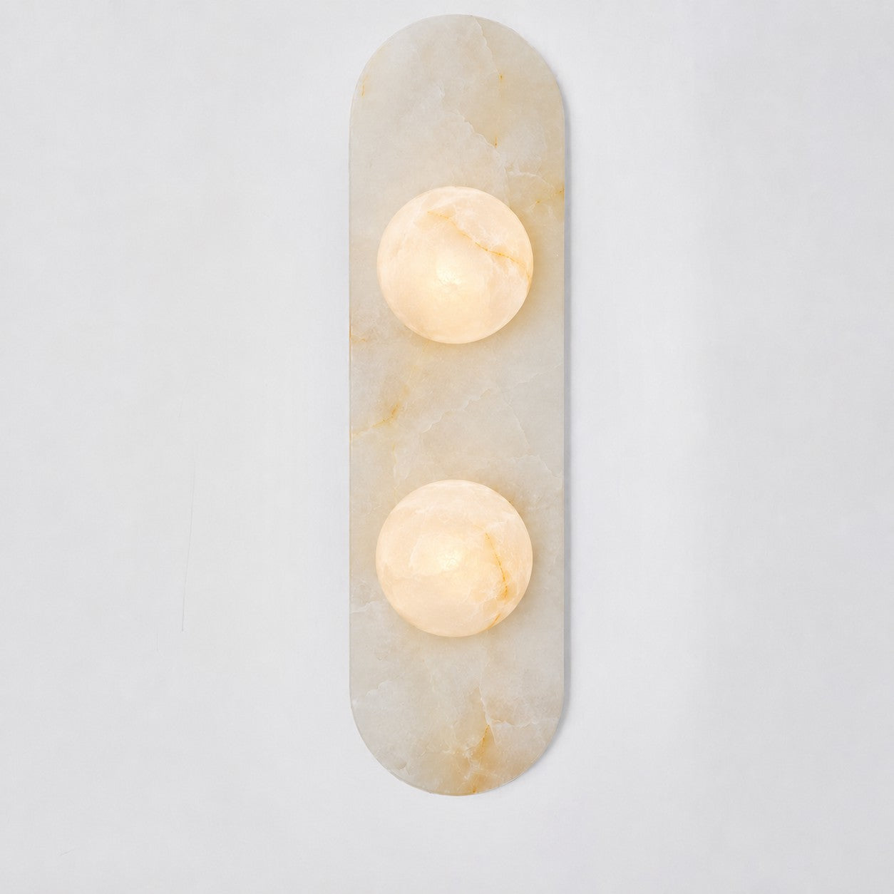 Close-up on the polished texture of the alabaster body.