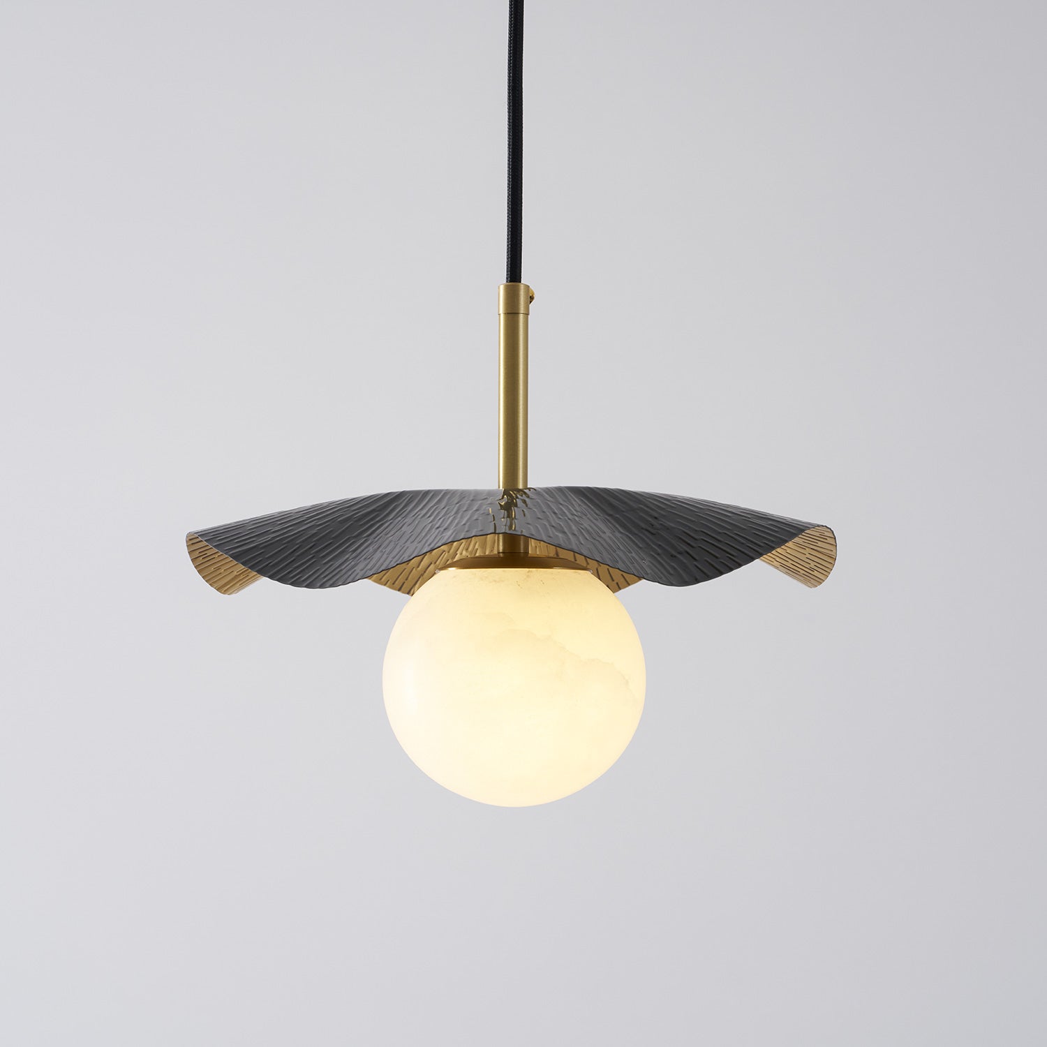 The lamp unlit, displaying the textures of the brass and alabaster materials.