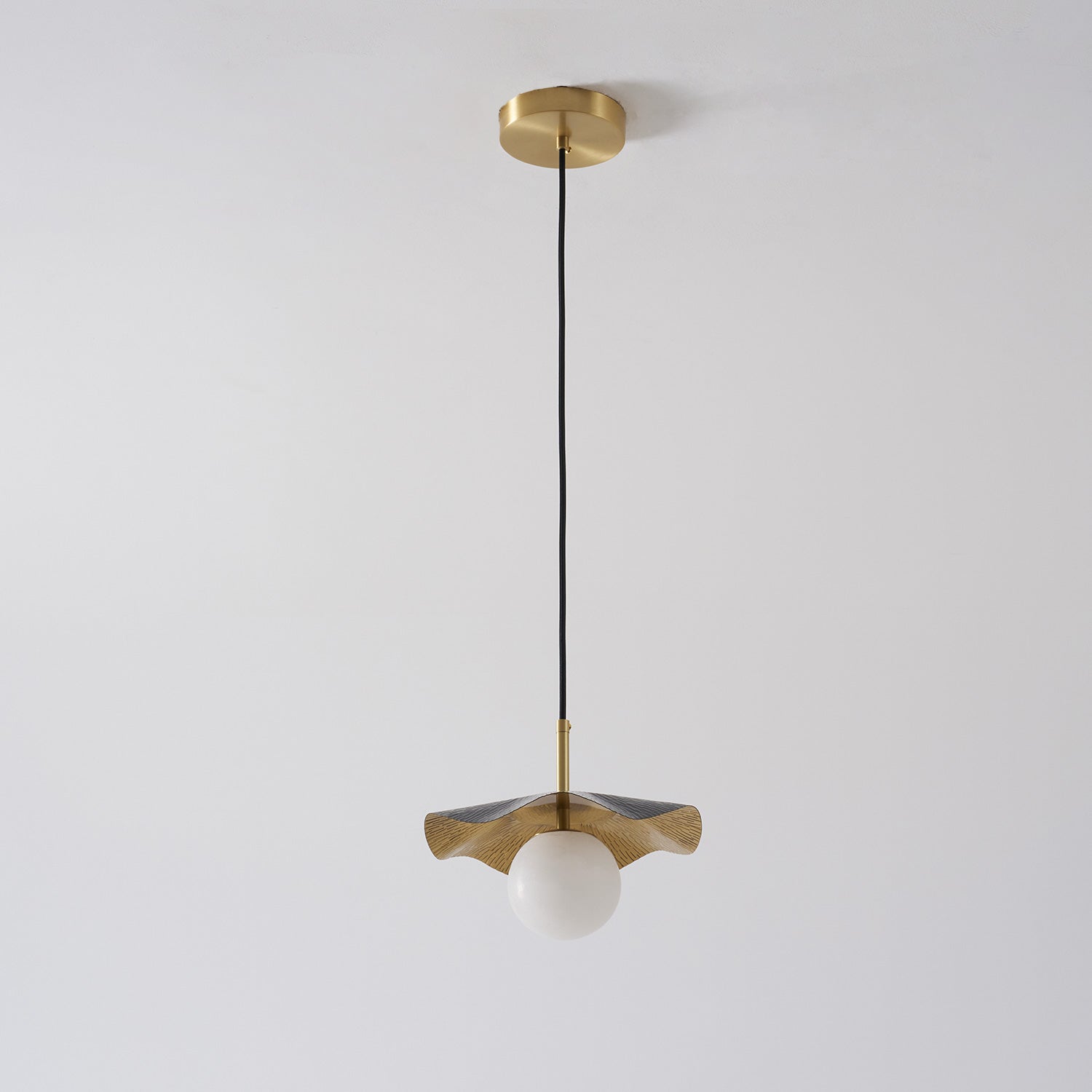 Comparison of the brass, white, and black finish options for the Bonnie lamp.