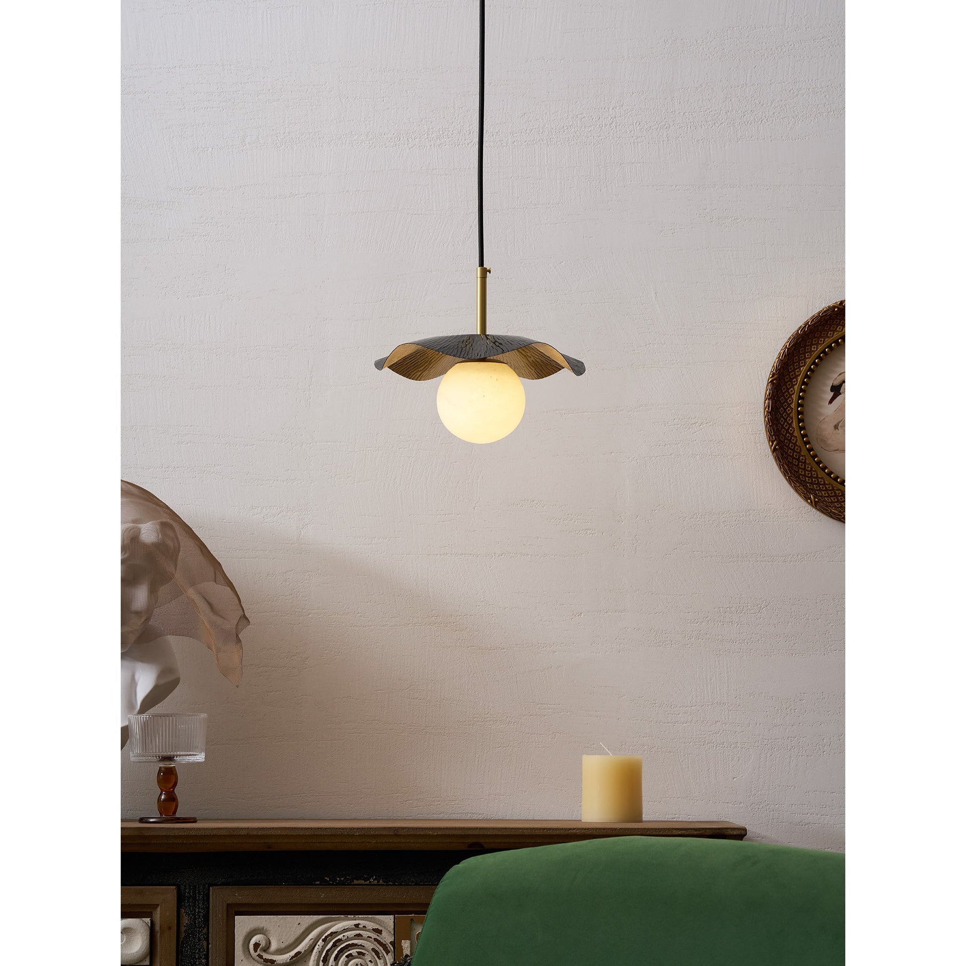 Installation view of the Bonnie Pendant Lamp with its ceiling mount and cord.
