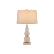 Niobe Table Lamp with travertine stacked-sphere base and linen drum shade.