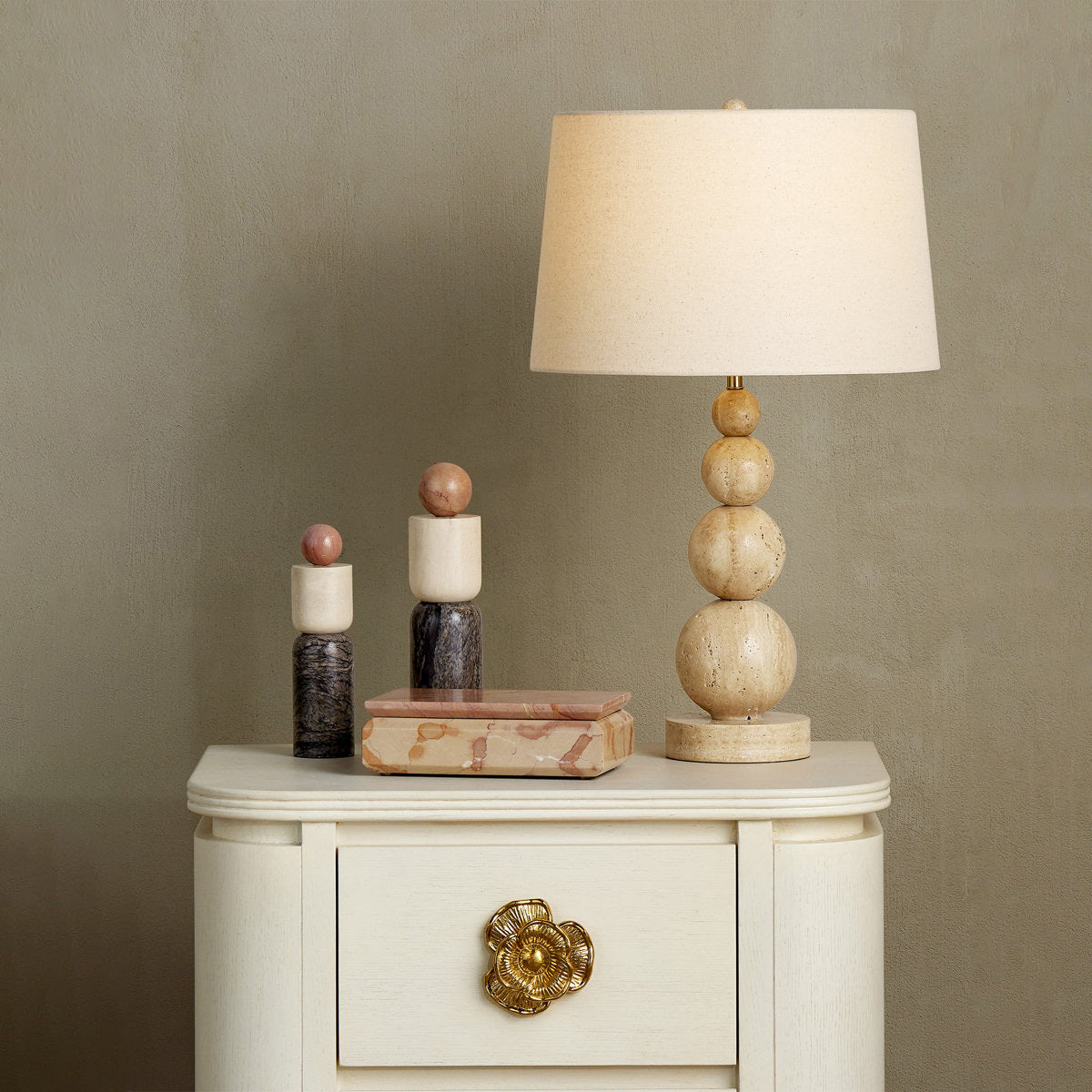 Close-up of the Niobe Table Lamp's natural travertine stone veining.
