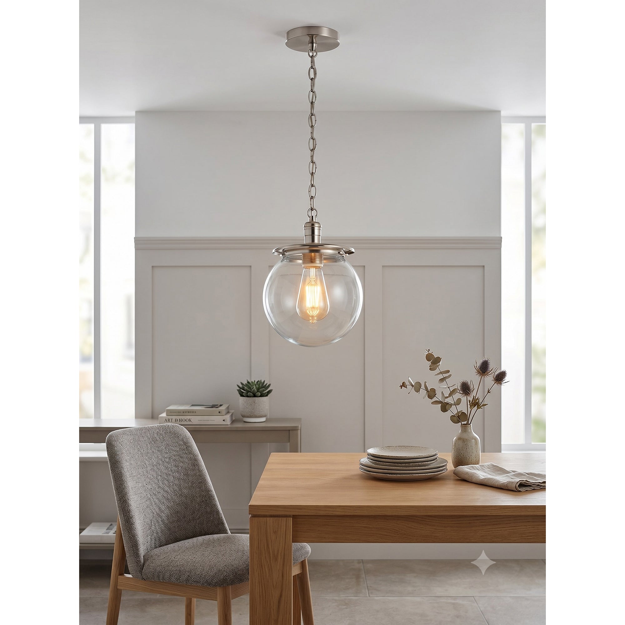 Nolan Globe Pendant Lamp, nickel finish with clear glass.