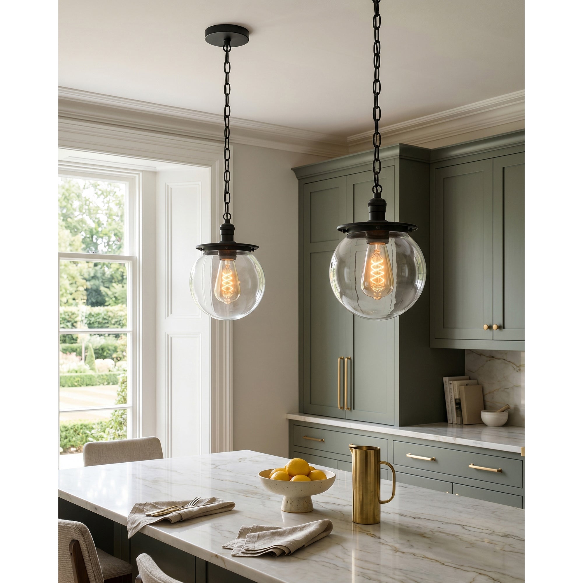 The adjustable brass chain of the Nolan pendant.