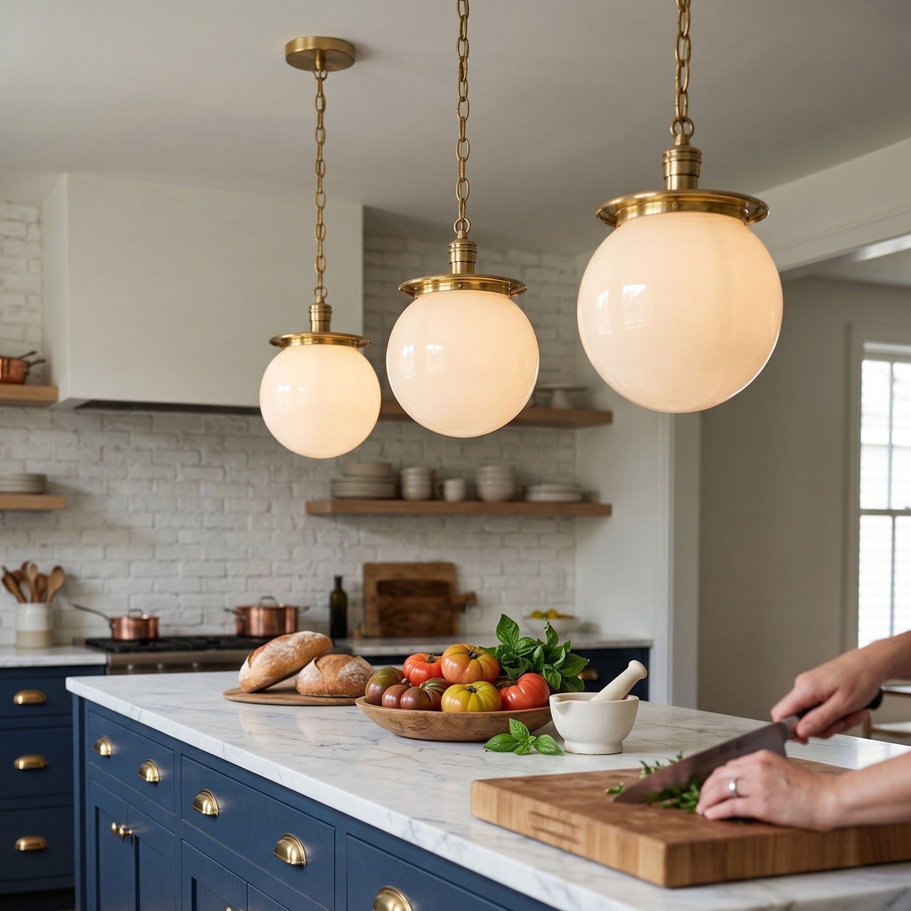 Close-up of the brass chain and canopy of the Nolan Globe Pendant.