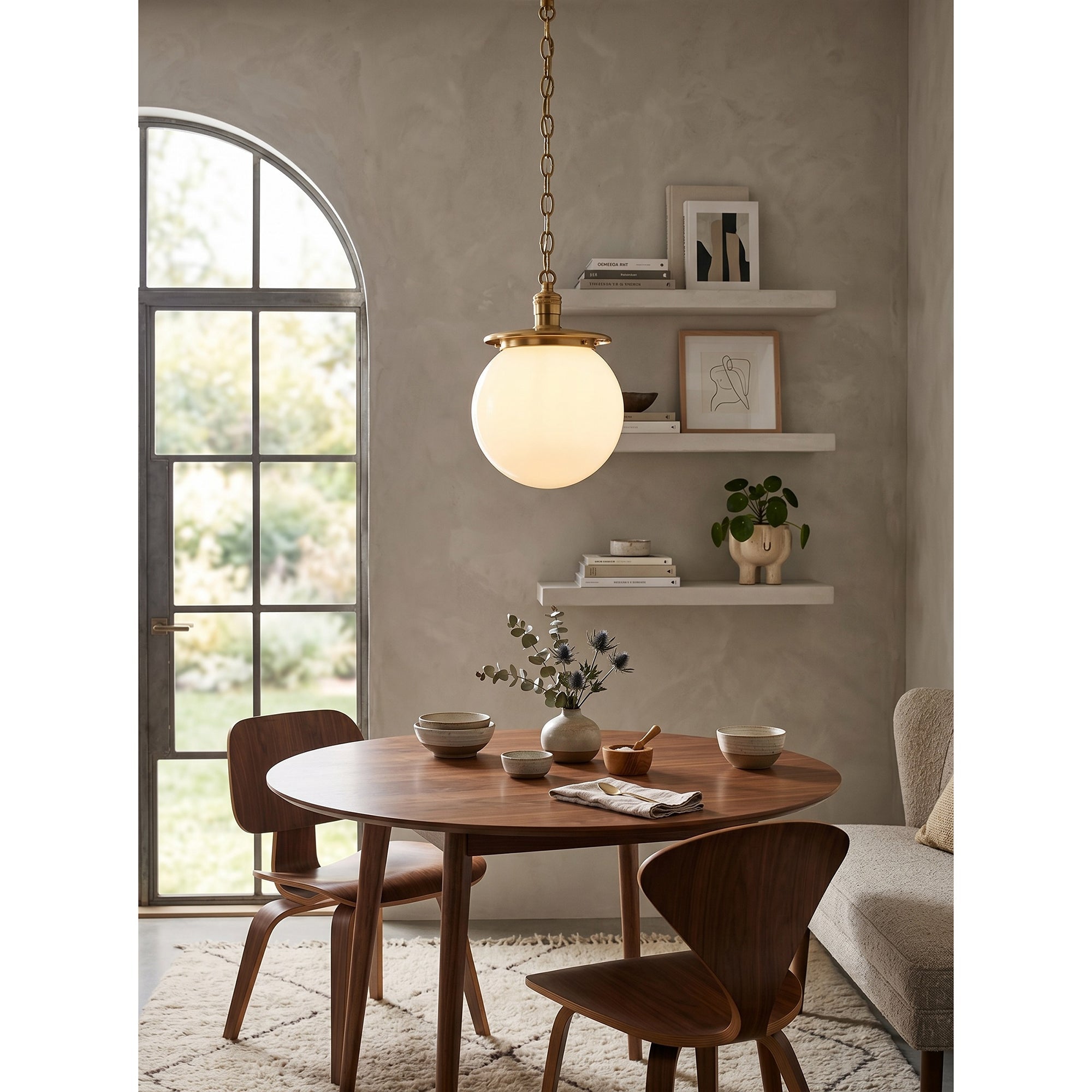 Nolan Globe Pendant Lamp in a nickel finish with a white glass shade.