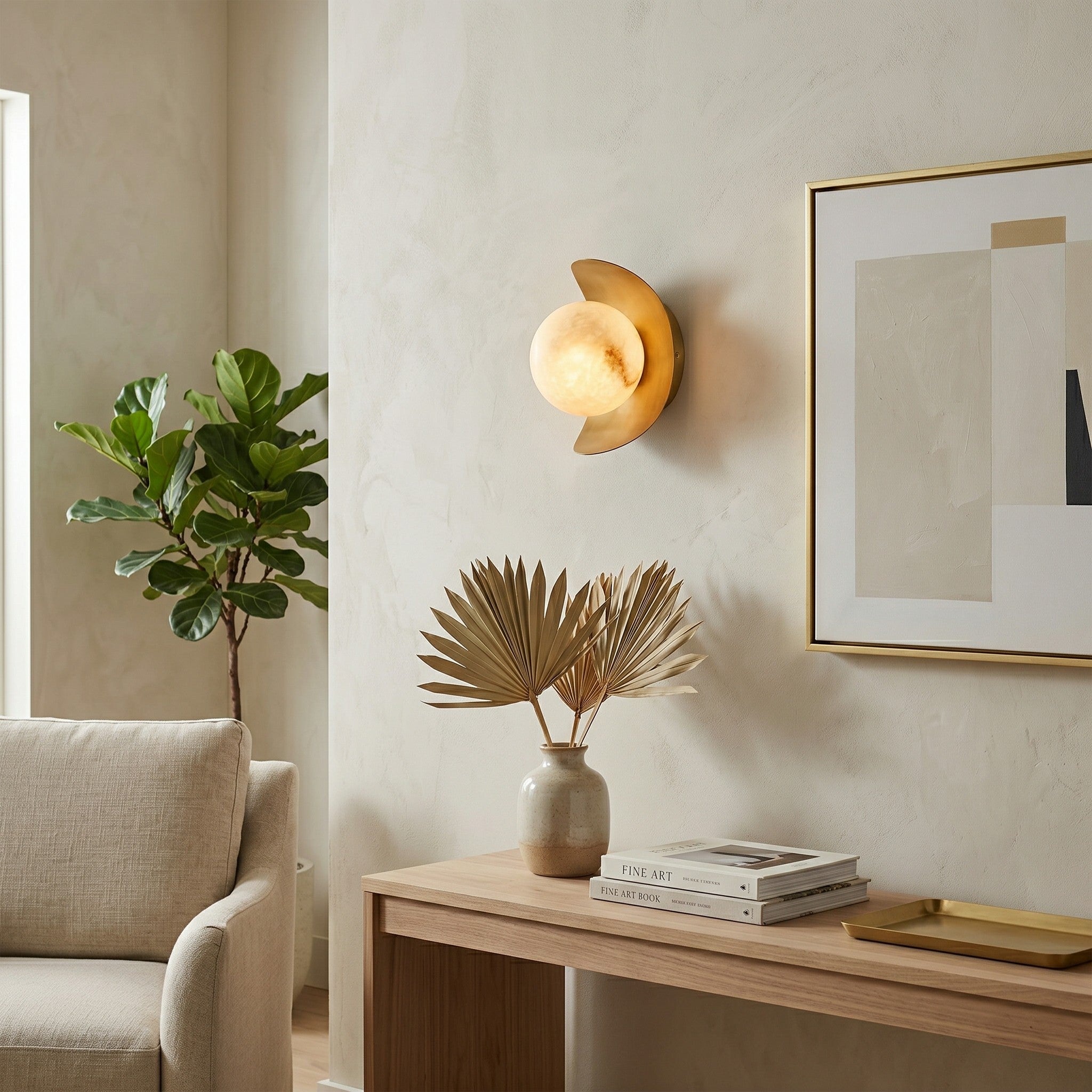 The Nouvel Alabaster Wall Sconce shown illuminated, casting a warm, soft glow.