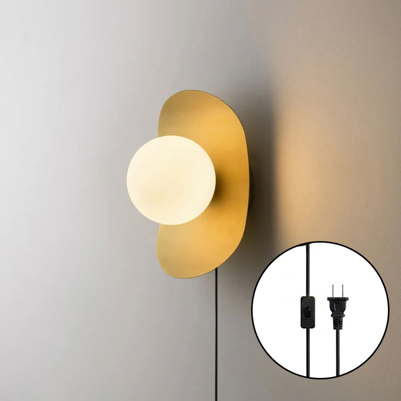 Front view of the Nouvel Wall Sconce in brass.