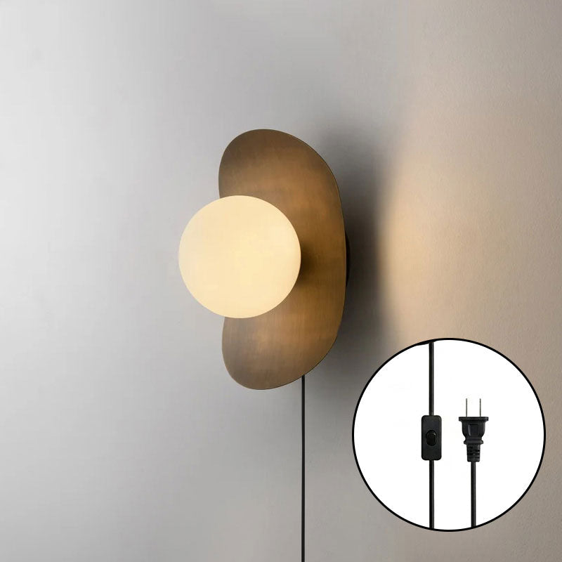 Nouvel Wall Sconce illuminating a hallway.