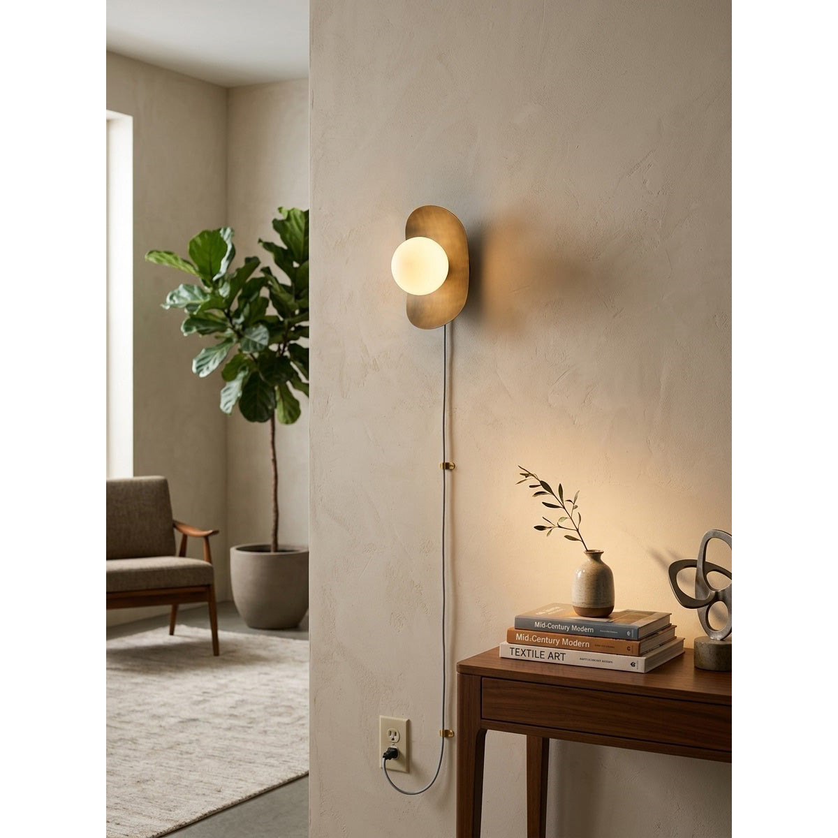 Nouvel Wall Sconce shown in a modern living room setting.