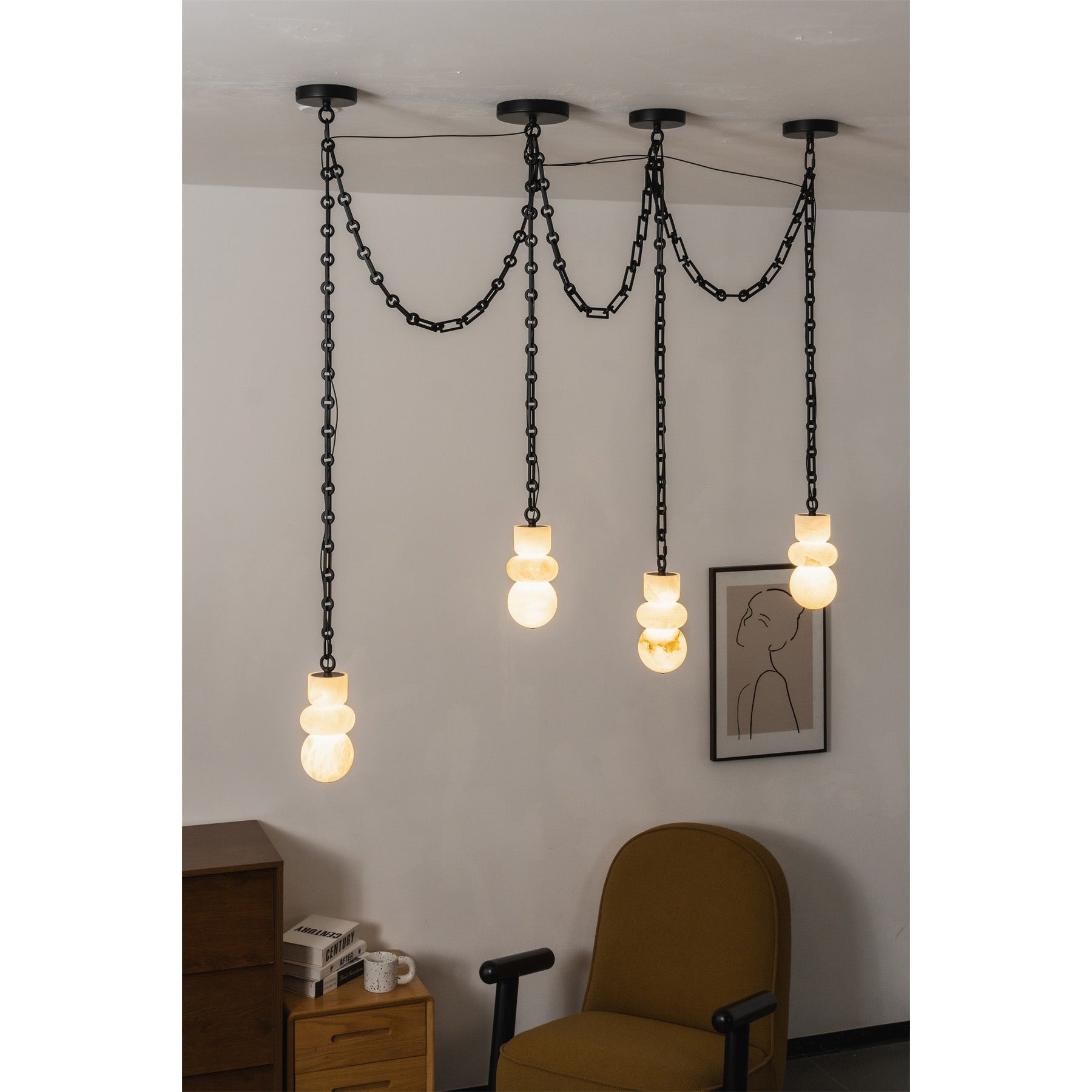 A two-head configuration of the Orba Chain Alabaster Chandelier.