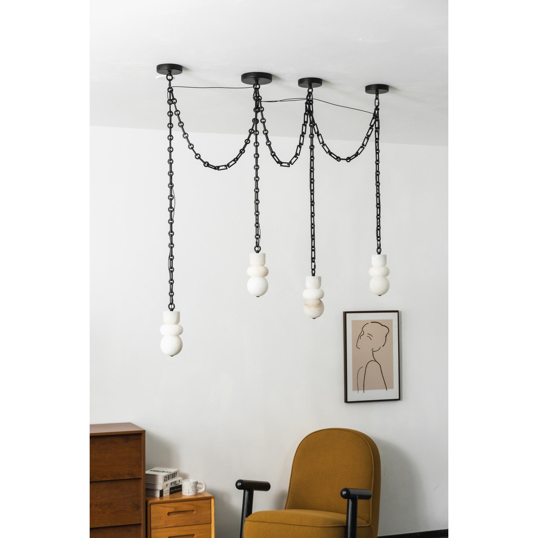 A seven-head configuration of the Orba Chain Alabaster Chandelier.