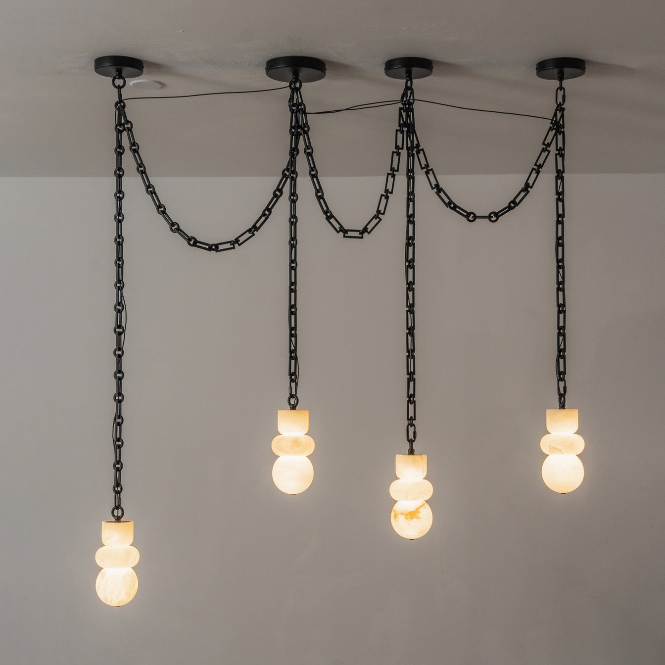 Orba chandelier as a focal point in an open-plan living area.