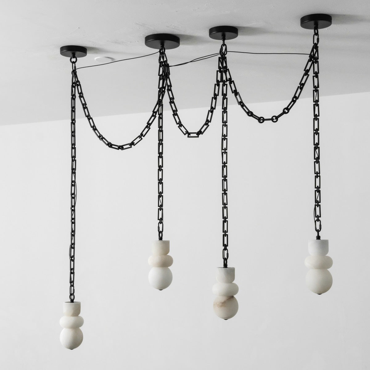 The interplay of light and shadow created by the Orba chandelier.