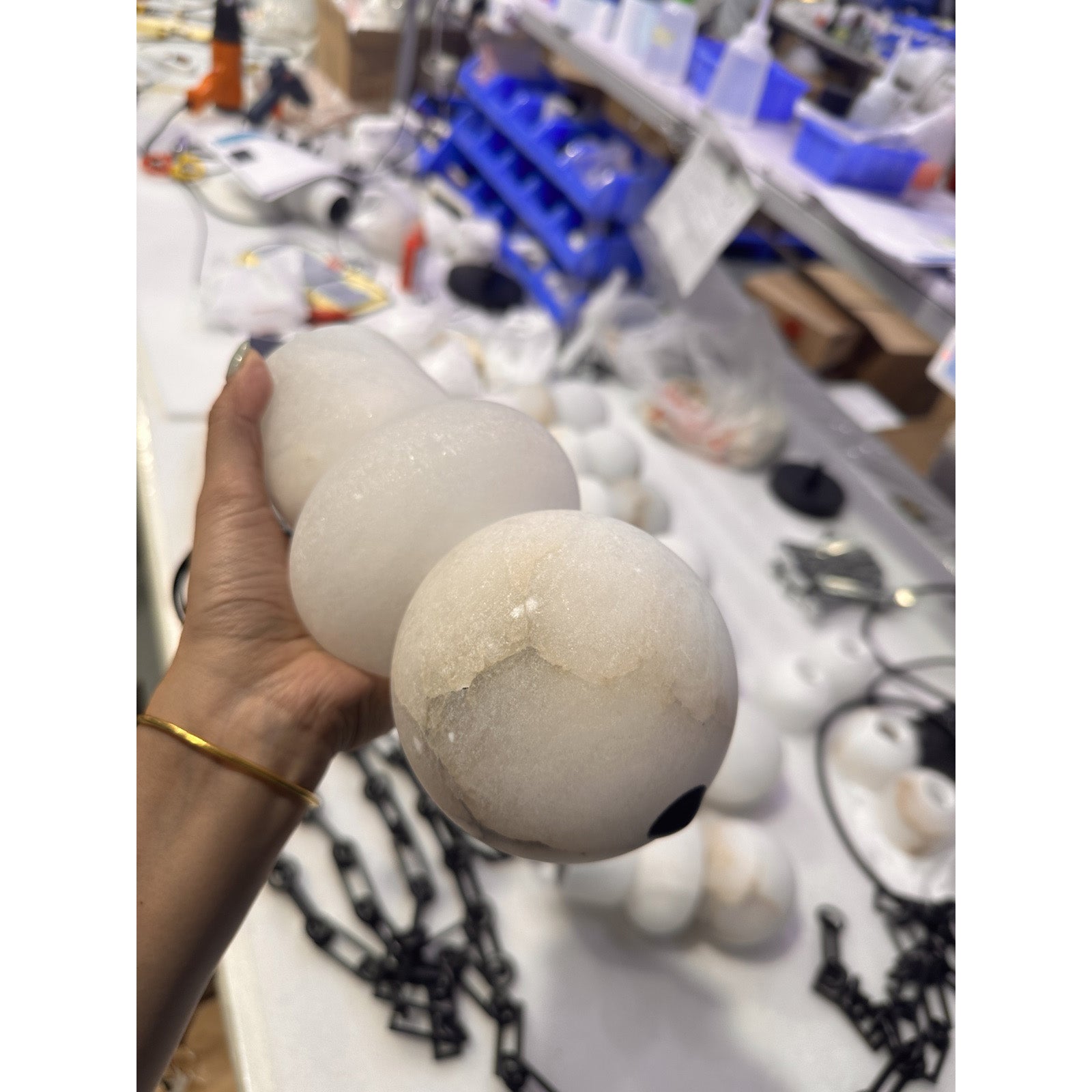 The chandelier's components: alabaster orb and iron chain.