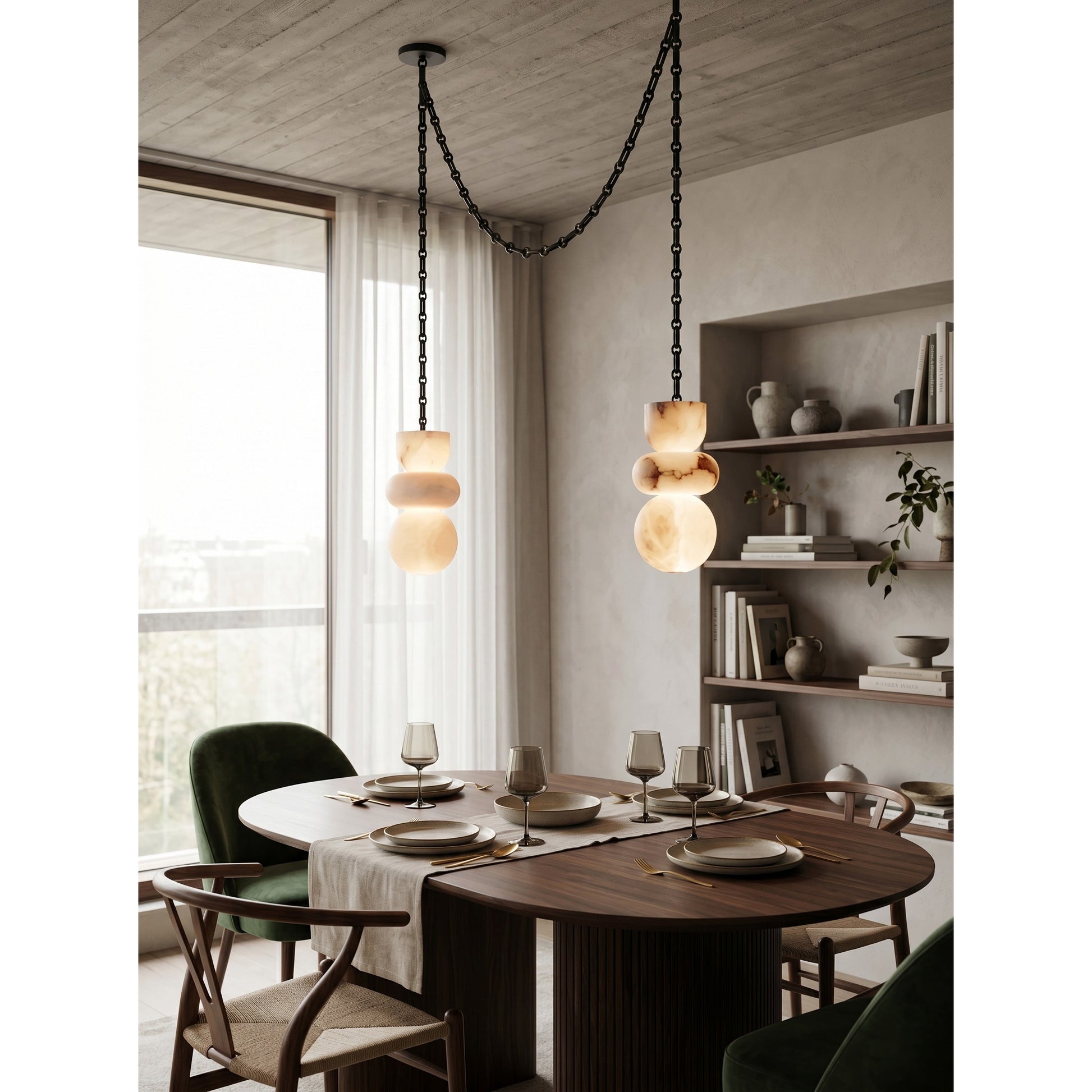 The industrial-style black chain detail of the Orba chandelier.