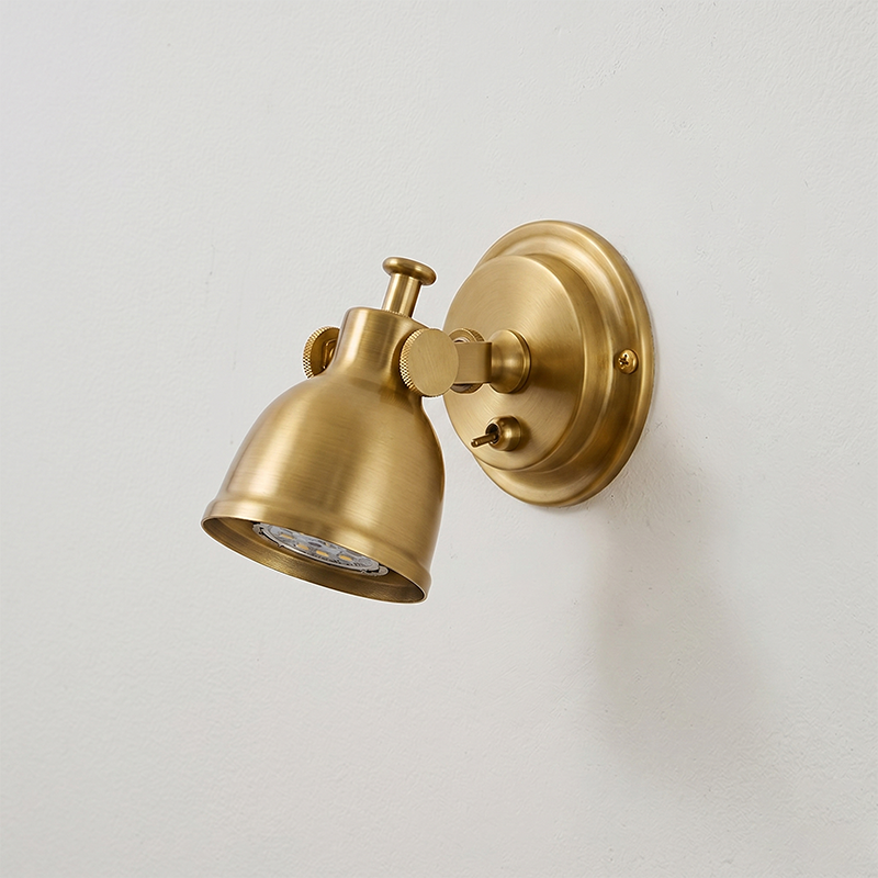 Orwell Wall Sconce in a minimalist entryway, adding an industrial touch.