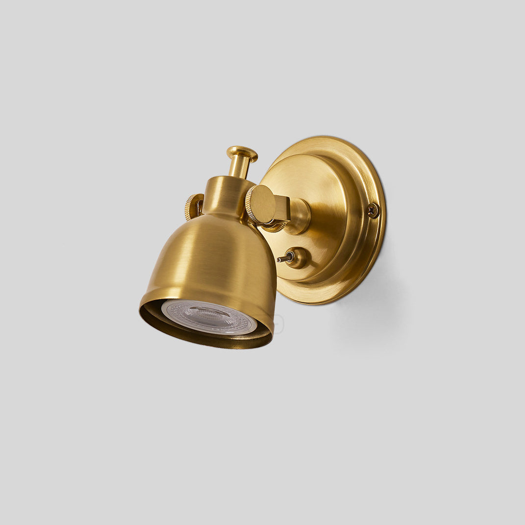 Close-up of the toggle switch on the nickel finish sconce.