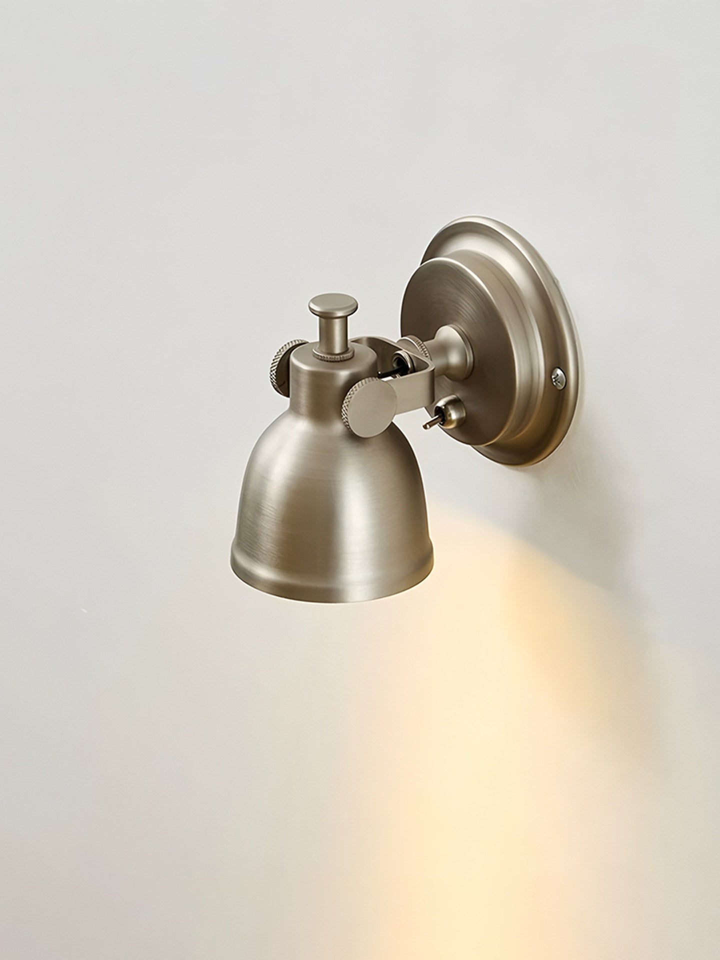 The classic dome shade of the industrial-style Orwell Wall Sconce.
