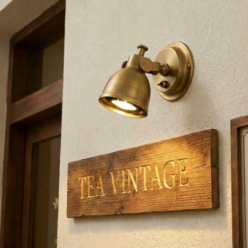 A pair of Orwell Wall Sconces in nickel flanking a bathroom mirror.