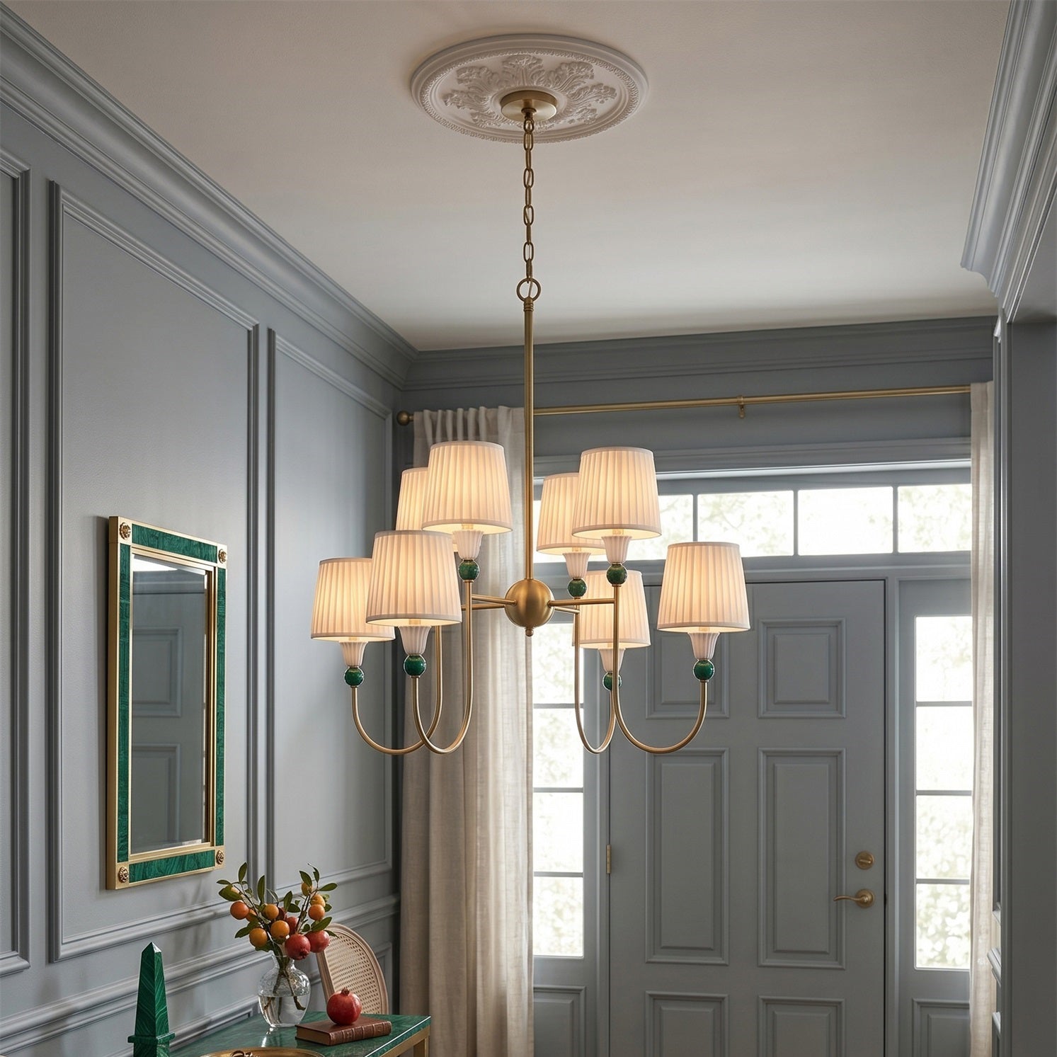 Detail view of the antique brass arm and pleated shade of the Palmer Chandelier.