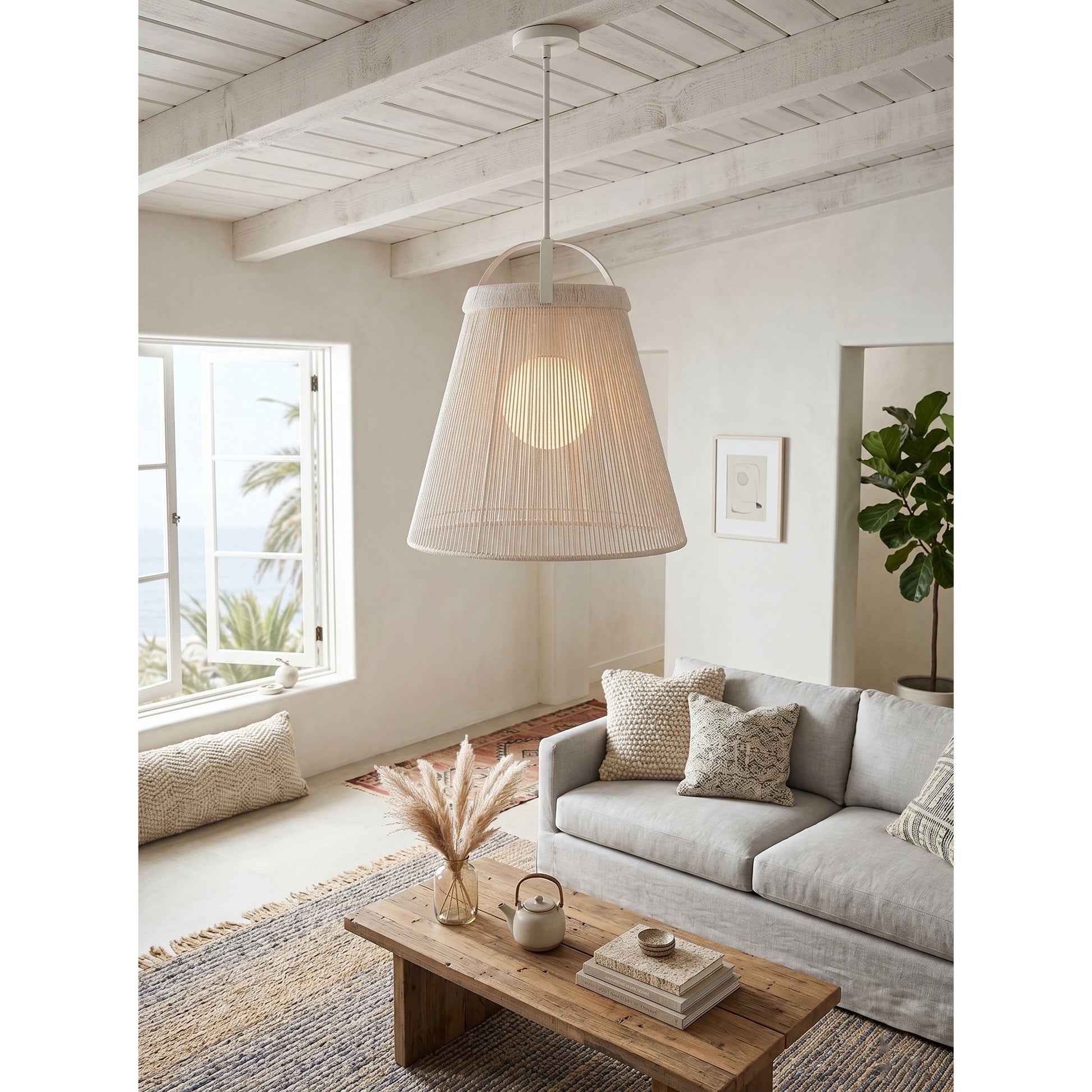 The off-white Parnell Pendant Lamp hanging over a dining table.