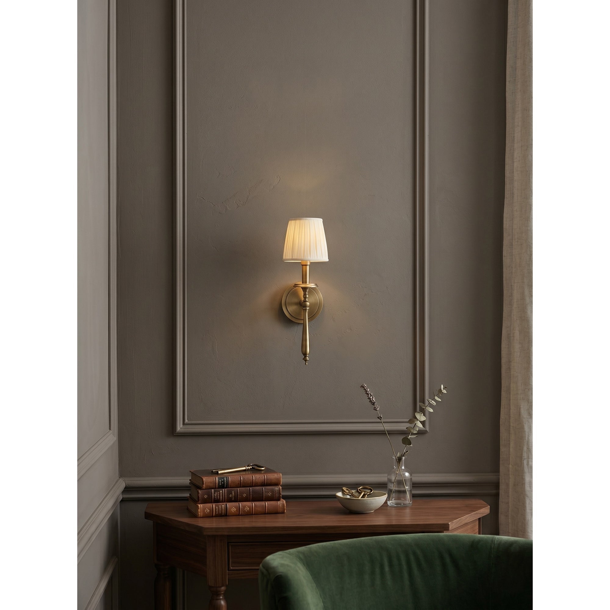 The wall sconce shown from the side profile.