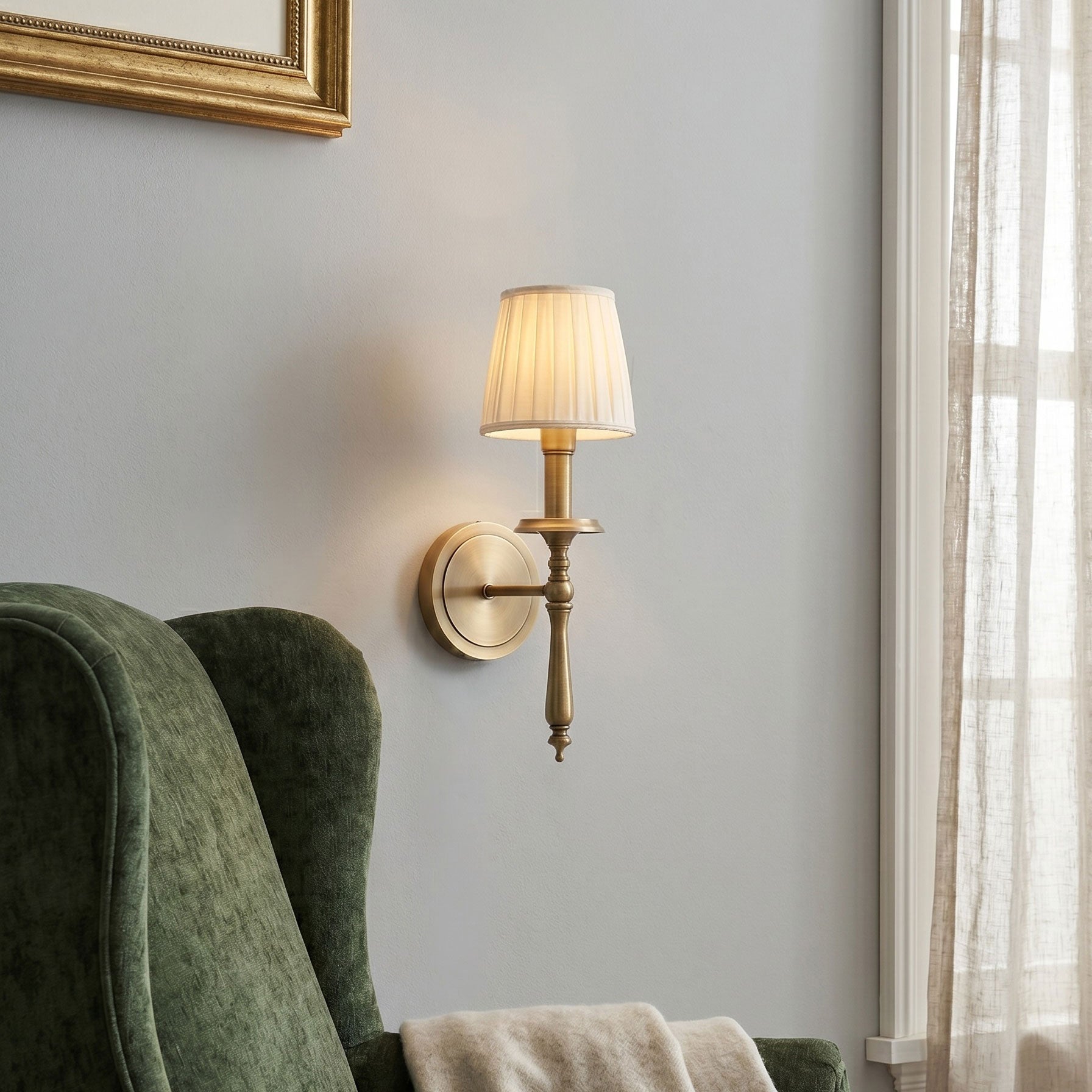Angled view of the Payson Wall Sconce highlighting its antique brass finish.