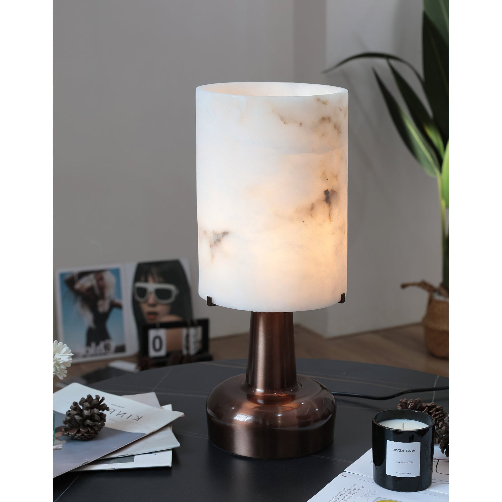 Angled view showcasing the lamp's blend of alabaster and rose gold.