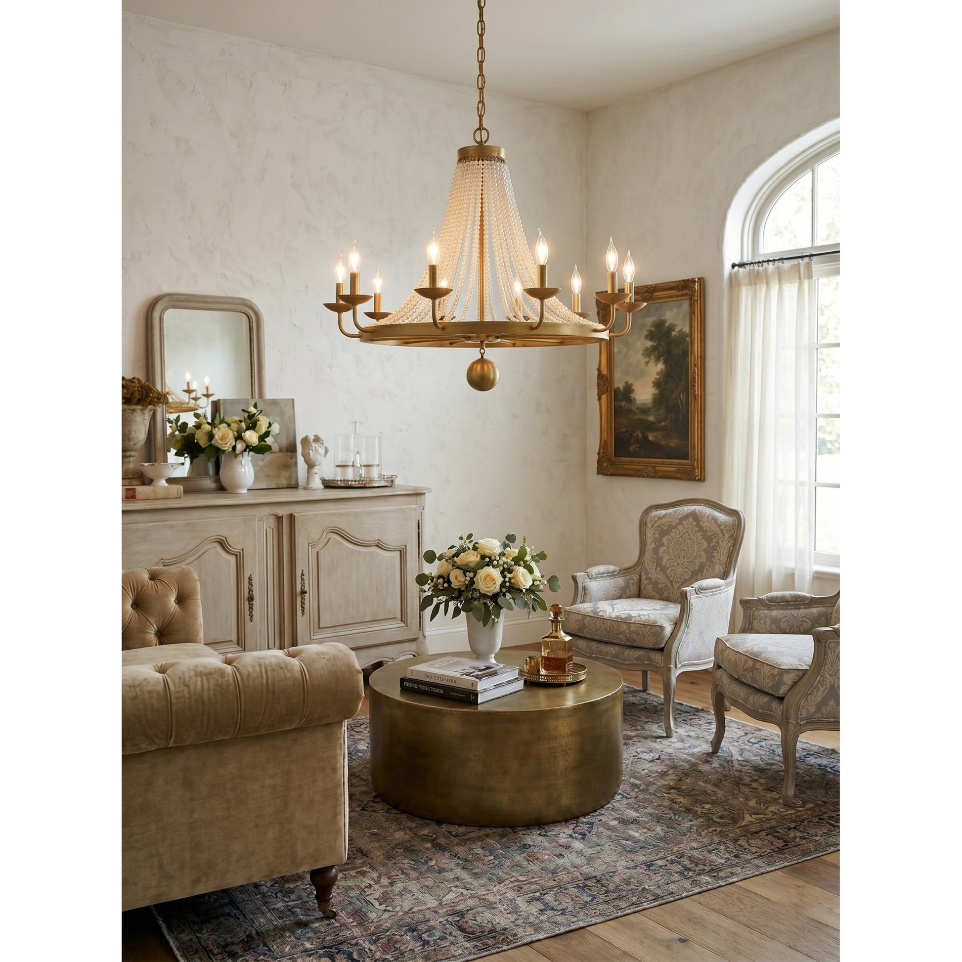 The Pearl Fiona Chandelier illuminated over a formal dining table.