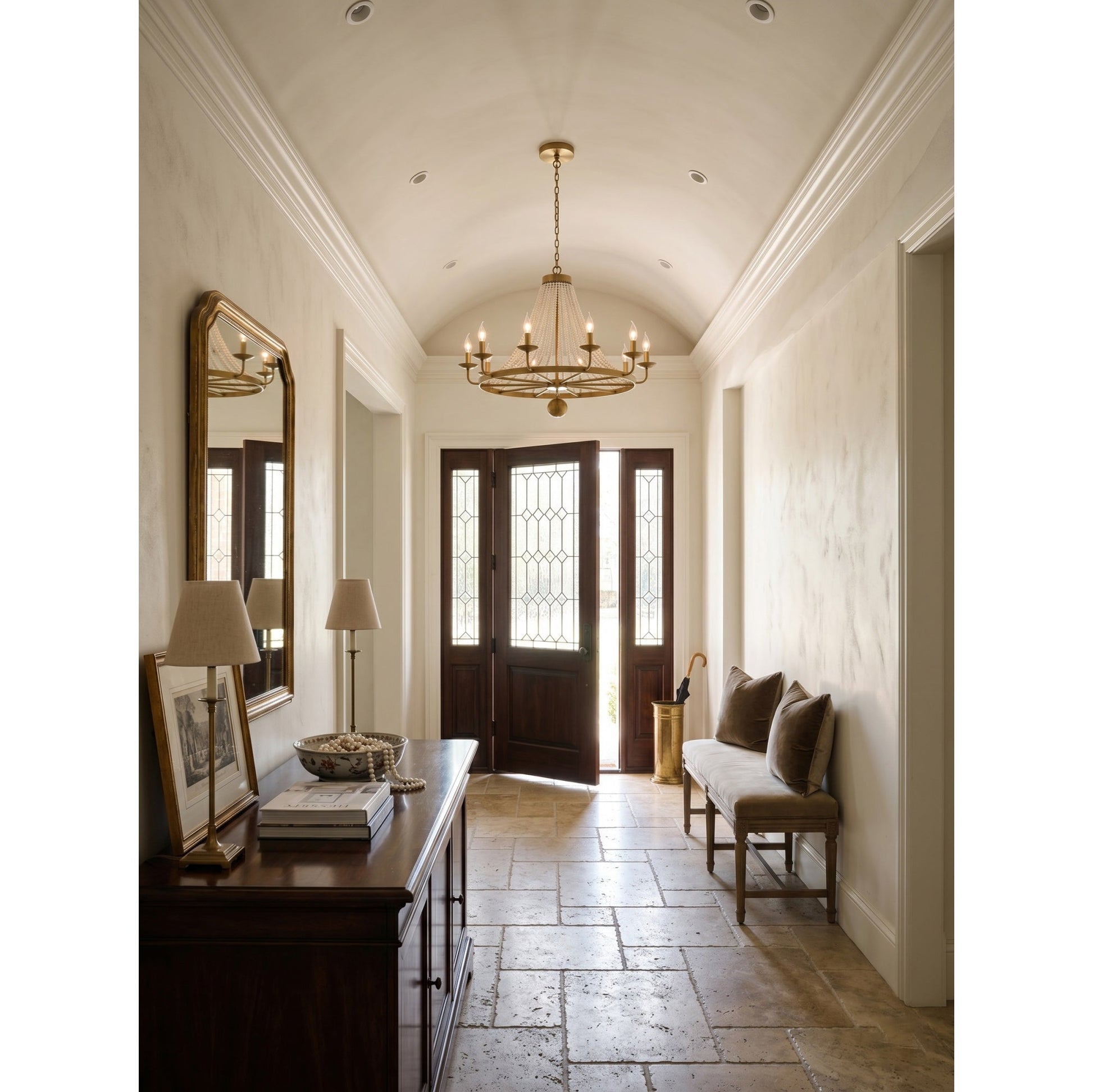 Lifestyle image of the chandelier in a high-ceiling foyer.