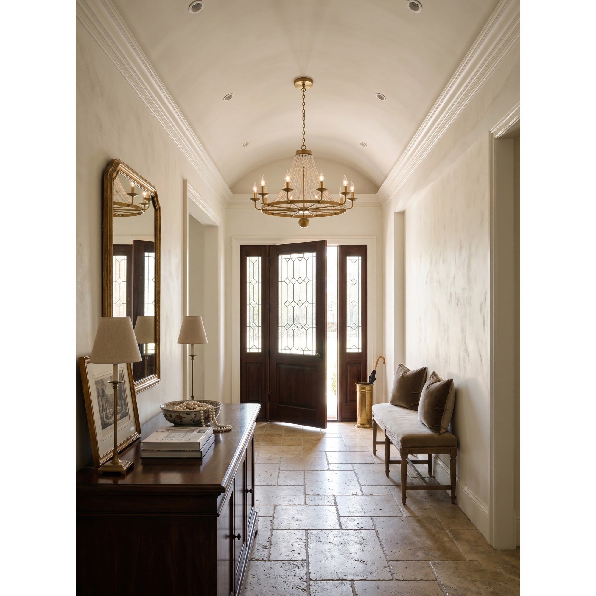 Lifestyle image of the chandelier in a high-ceiling foyer.