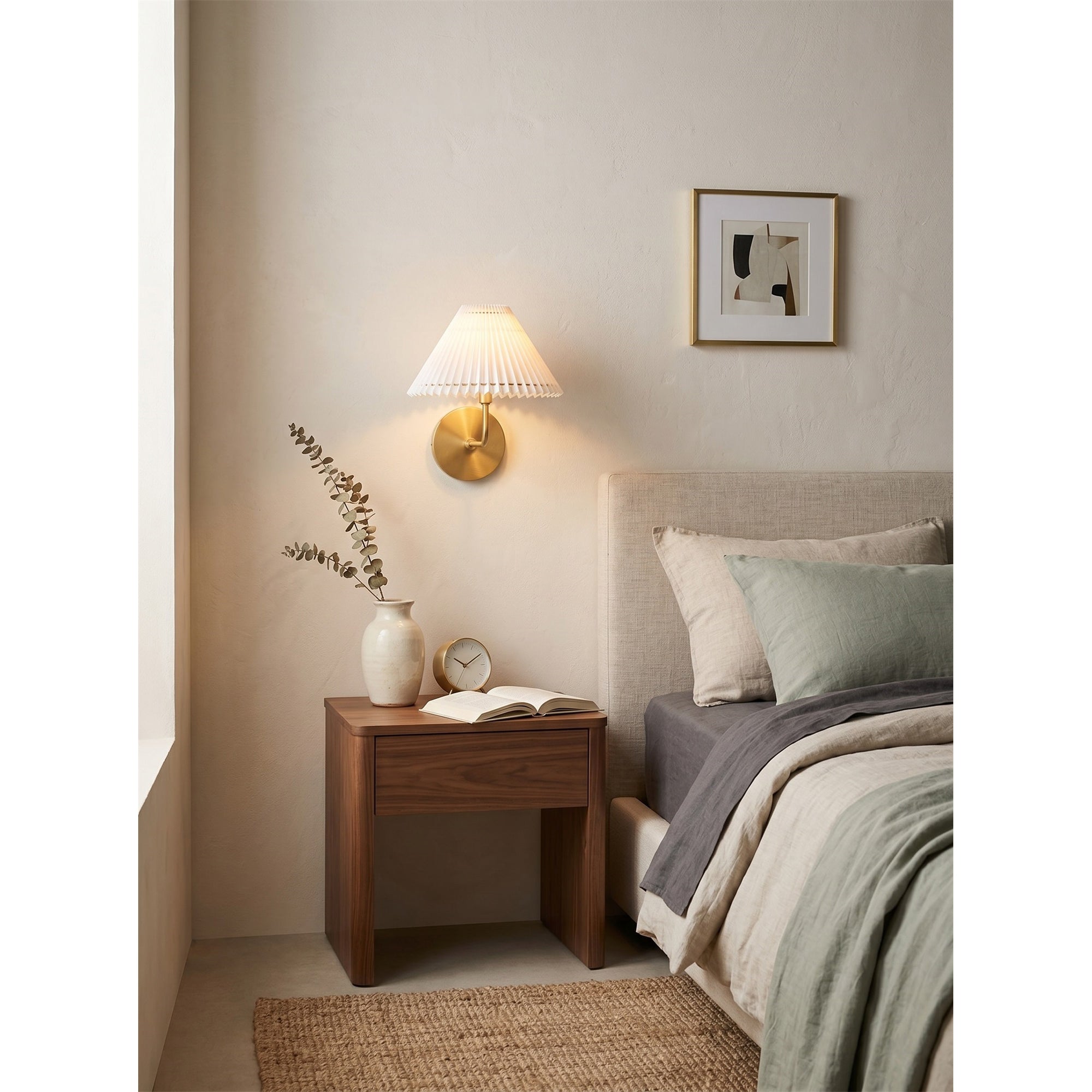 Pearson Wall Sconce in black finish against a light-colored wall.