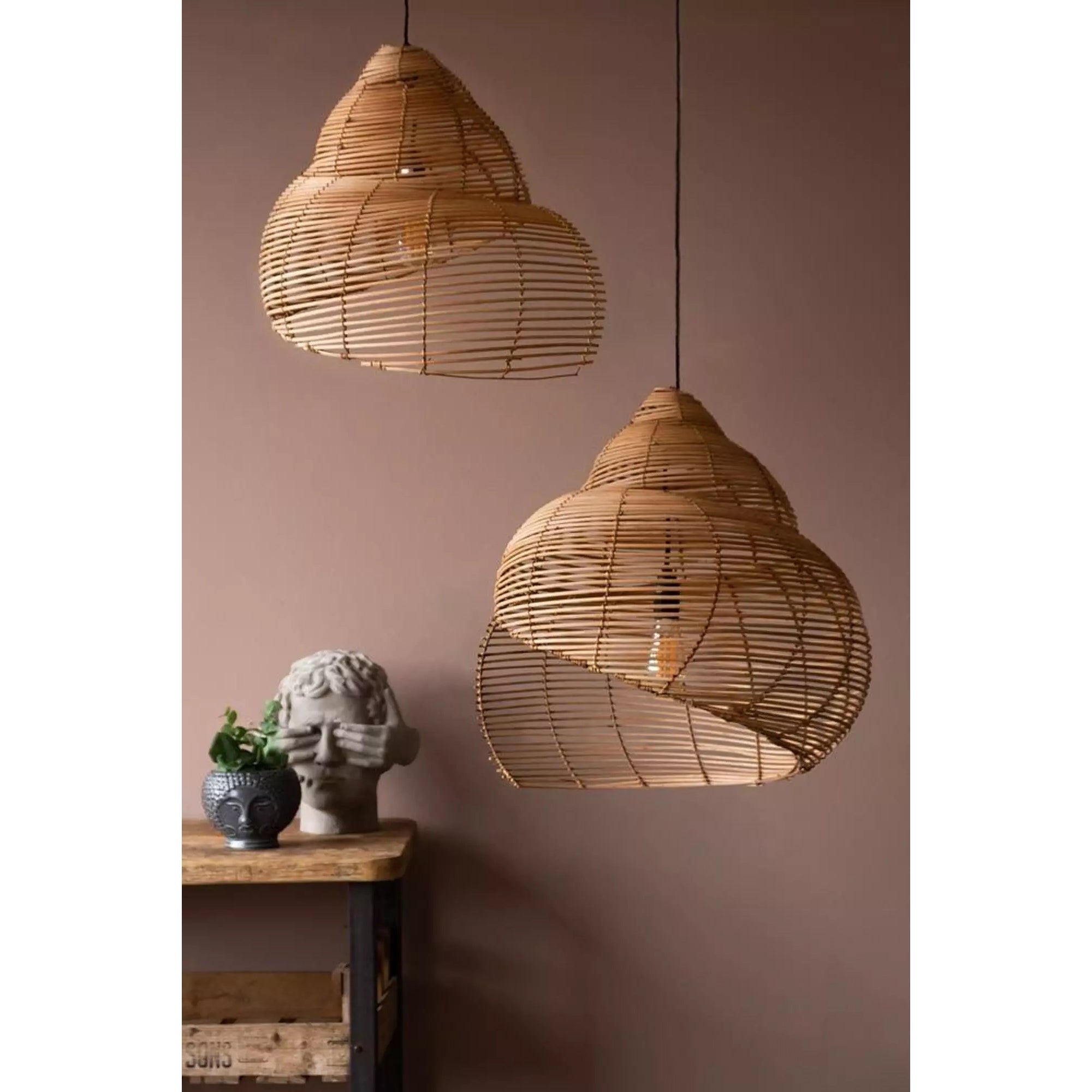 The lamp shown in a room with large windows and natural light.