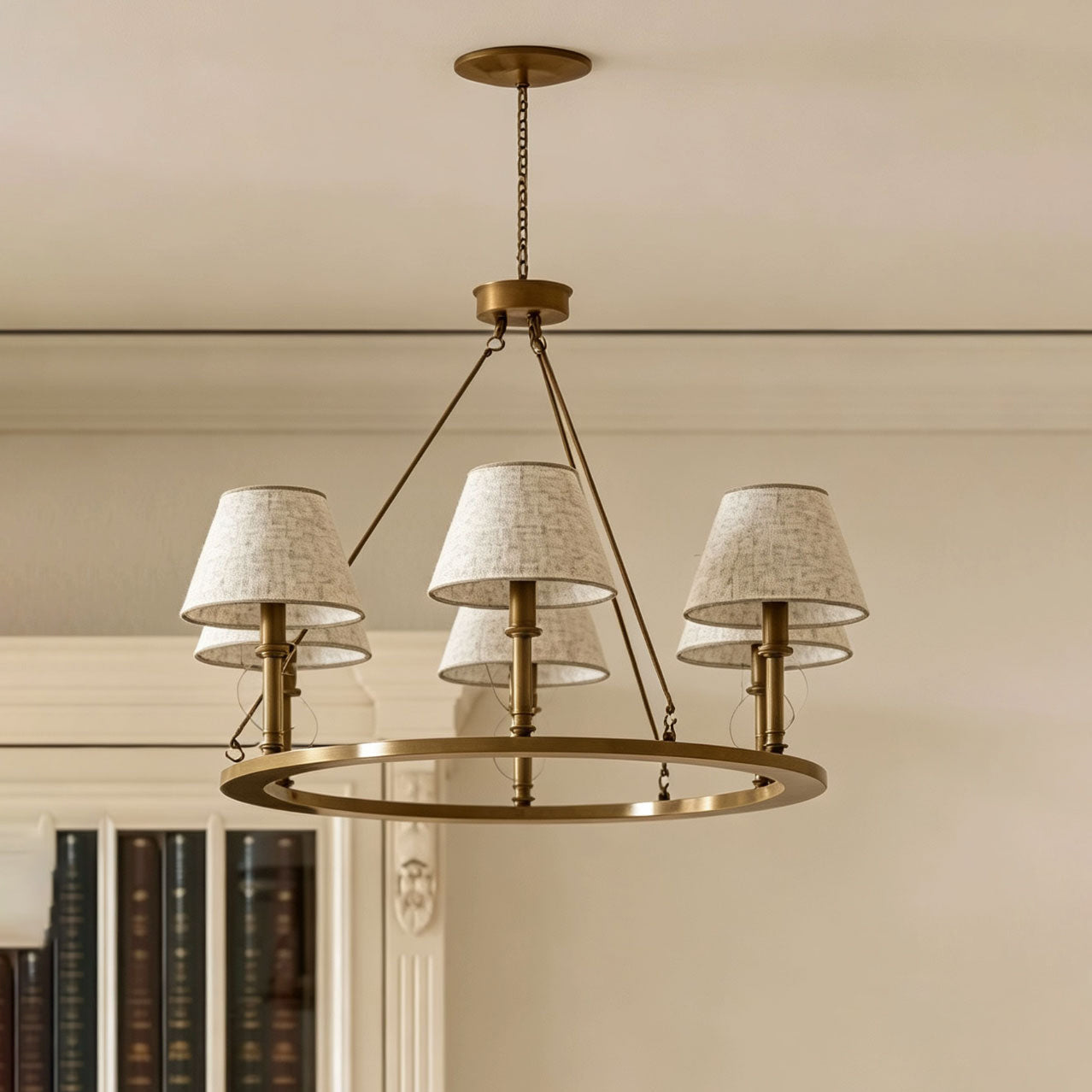 Close-up of the black brass frame and a linen drum shade.