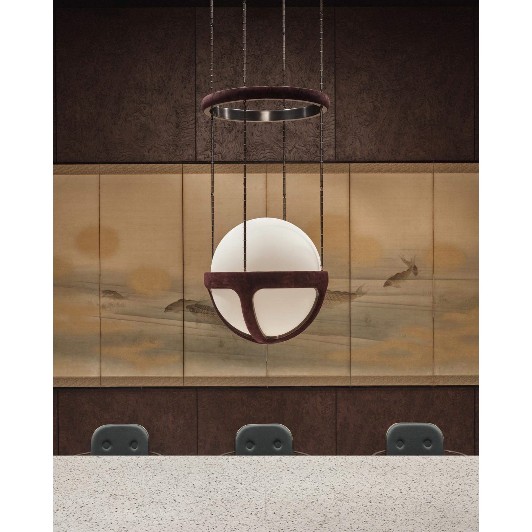 The pendant lamp in a two-story foyer, showcasing its scale.